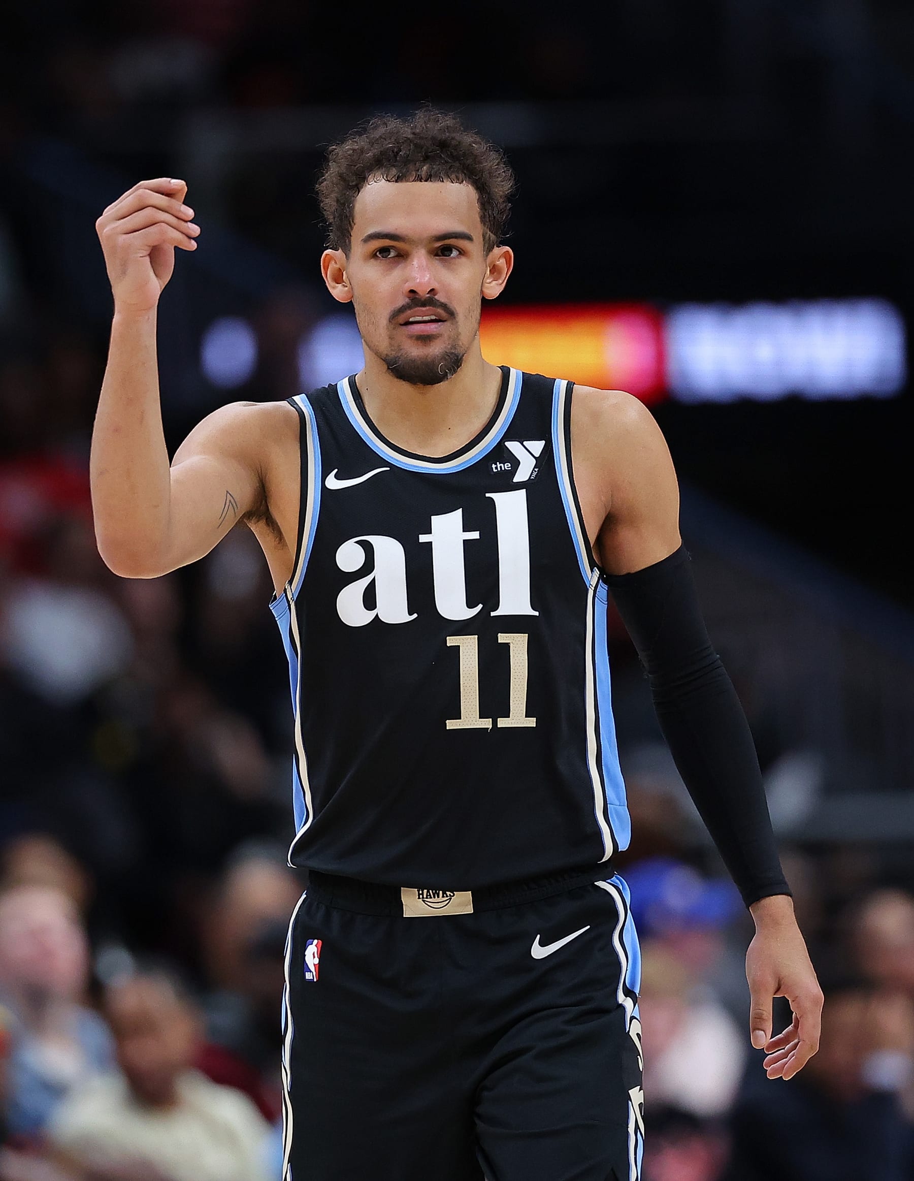 ATLANTA, GEORGIA - FEBRUARY 12:  Trae Young #11 of the Atlanta Hawks reacts after being charged with a technical foul for flopping by official Brent Barnaky #36 against the Chicago Bulls during the fourth quarter at State Farm Arena on February 12, 2024 in Atlanta, Georgia.  NOTE TO USER: User expressly acknowledges and agrees that, by downloading and/or using this photograph, user is consenting to the terms and conditions of the Getty Images License Agreement.  (Photo by Kevin C. Cox/Getty Images)