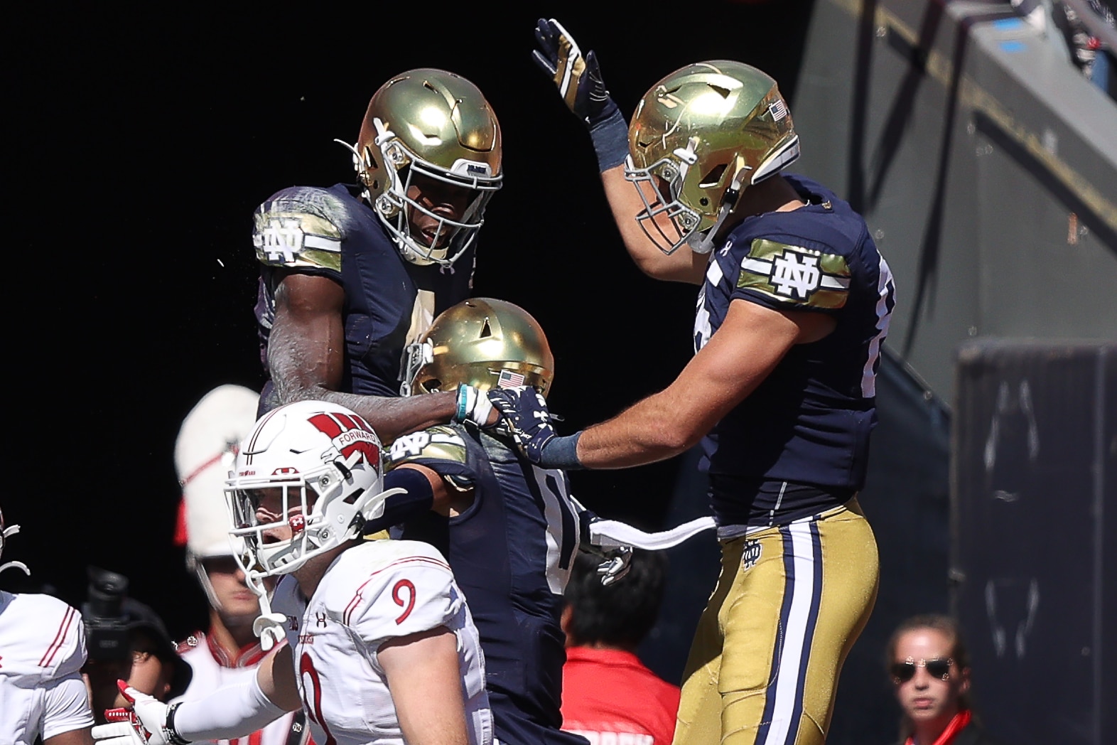 CHICAGO, IL - SEPTEMBER 25: Notre Dame Fighting Irish wide receiver Kevin Austin Jr. (4) celebrates with teammates after scoring a touchdown during the Shamrock Series game between the Notre Dame Fighting Irish and the Wisconsin Badgers on September 25, 2021 at Soldier Field, in Chicago, IL. (Photo by Robin Alam/Icon Sportswire via Getty Images)