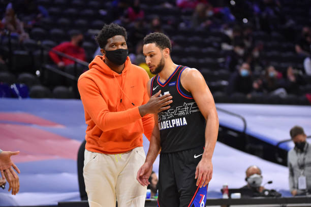 PHILADELPHIA, PA - MARCH 17: Joel Embiid #21 of the Philadelphia 76ers and Ben Simmons #25 of the Philadelphia 76ers talk during a game on March 17, 2021 at Wells Fargo Center in Philadelphia, Pennsylvania. NOTE TO USER: User expressly acknowledges and agrees that, by downloading and/or using this Photograph, user is consenting to the terms and conditions of the Getty Images License Agreement. Mandatory Copyright Notice: Copyright 2021 NBAE (Photo by Jesse D. Garrabrant/NBAE via Getty Images)