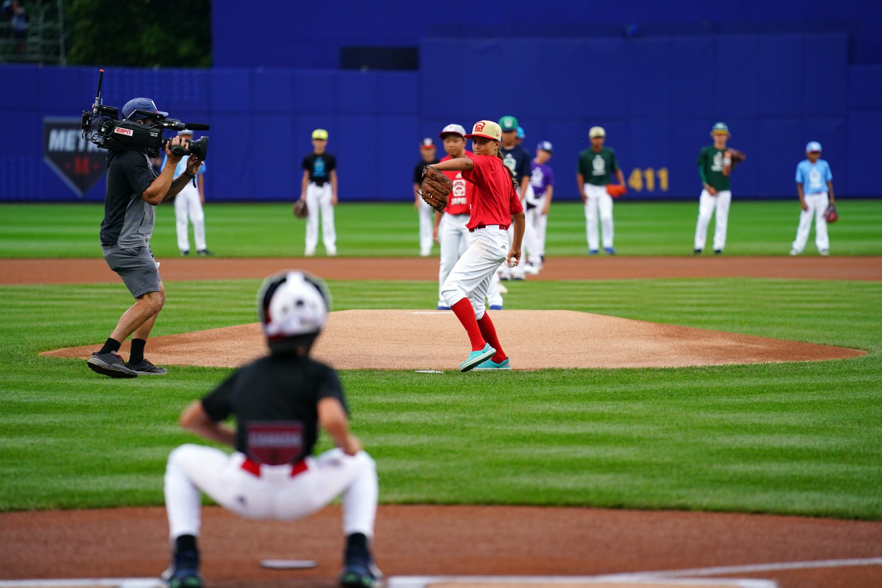 SOUTH WILLIAMSPORT, PA - AUGUST 21:  2022 Little League World Series participants throw out the ceremonial first pitch prior to the game between the Boston Red Sox and the Baltimore Orioles at Muncy Bank Park at Historic Bowman Field on Sunday, August 21, 2022 in South Williamsport, Pennsylvania. (Photo by Daniel Shirey/MLB Photos via Getty Images)