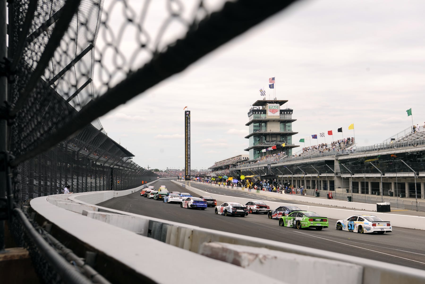 INDIANAPOLIS, IN - AUGUST 15: The field heads down the front stretch on a restart during the NASCAR Cup Series Verizon 200 at the Brickyard on August 15, 2021, at the Indianapolis Motor Speedway Road Course in Speedway Indiana. (Photo by Michael Allio/Icon Sportswire via Getty Images)