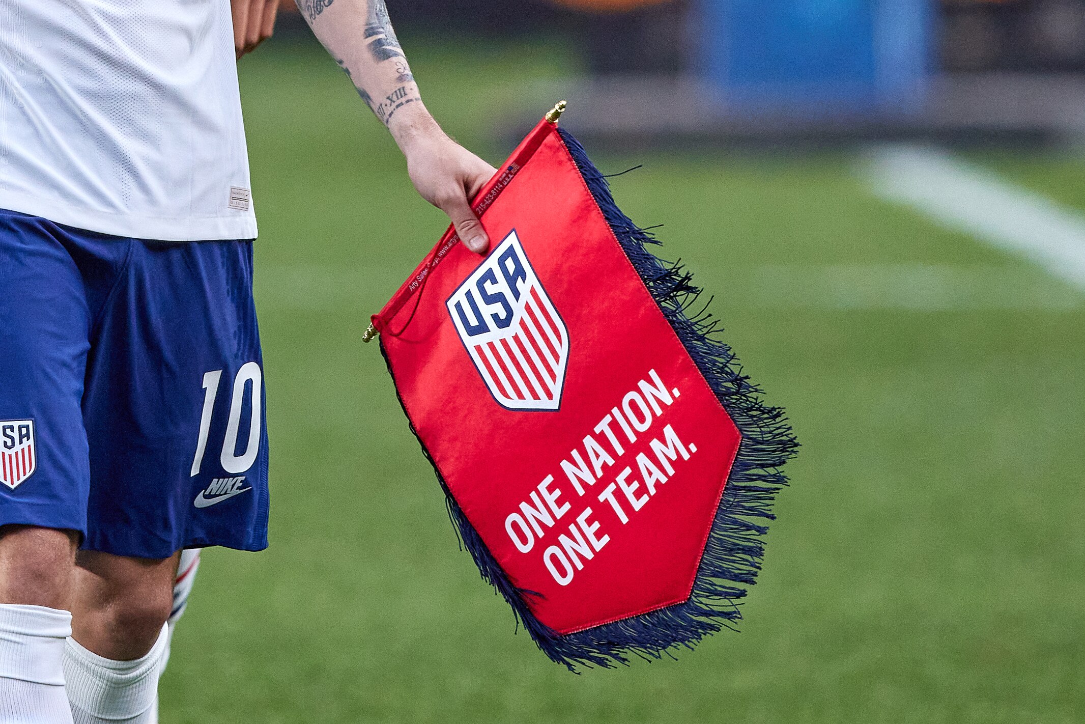DENVER, CO - JUNE 06: United States forward Christian Pulisic (10) is seen holding the United States Soccer Federation Crest in action during the CONCACAF Nations League finals between Mexico and the United States on June 06, 2021, at Empower Field at Mile High in Denver, CO. (Photo by Robin Alam/Icon Sportswire via Getty Images)