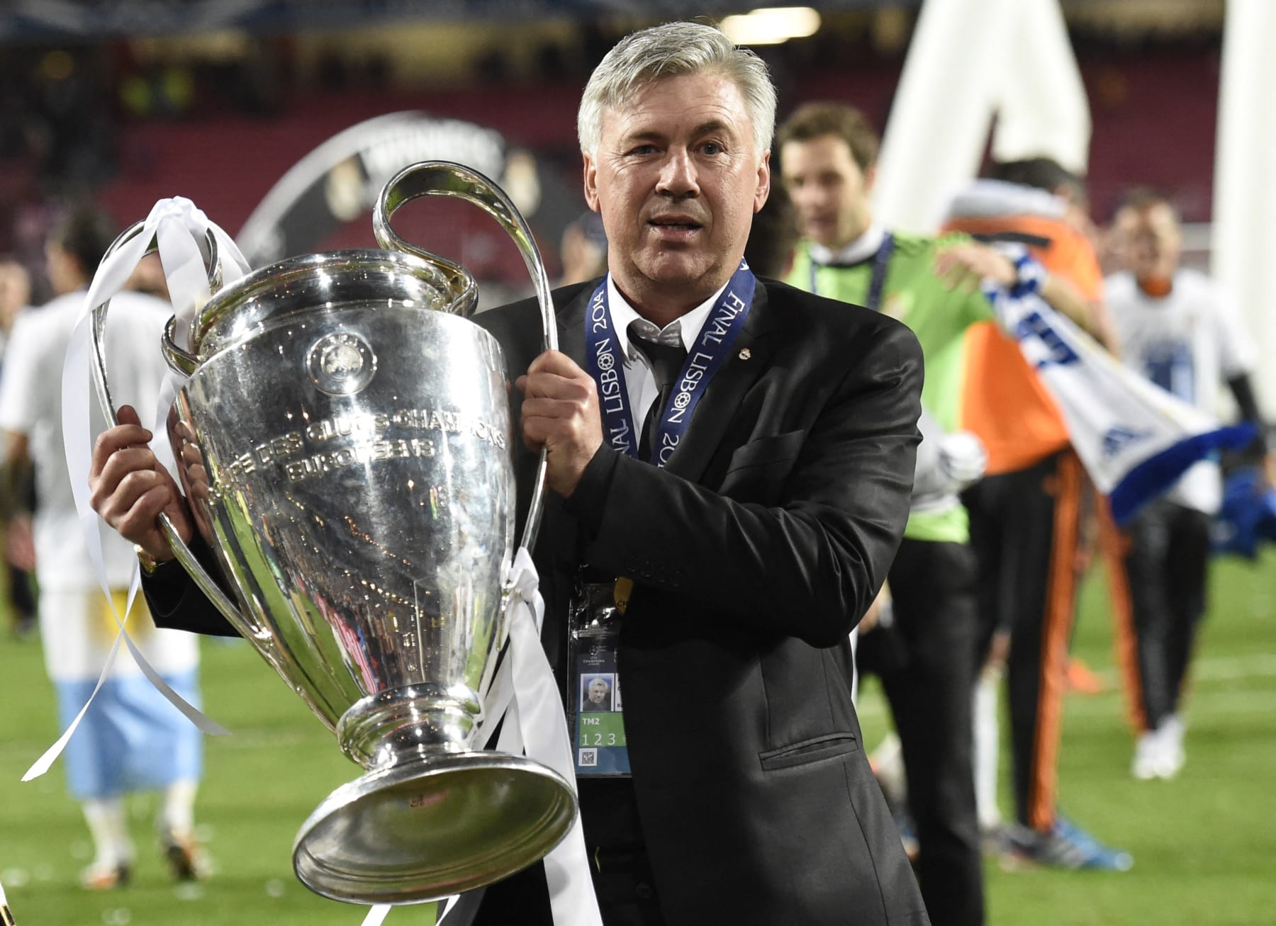 Real Madrid's Italian coach Carlo Ancelotti poses with the trophy at the end of the UEFA Champions League Final Real Madrid vs Atletico de Madrid at Luz stadium in Lisbon, on May 24, 2014. Real Madrid won 4-1.  AFP PHOTO/ FRANCK FIFE (Photo by Franck FIFE / AFP) (Photo by FRANCK FIFE/AFP via Getty Images)