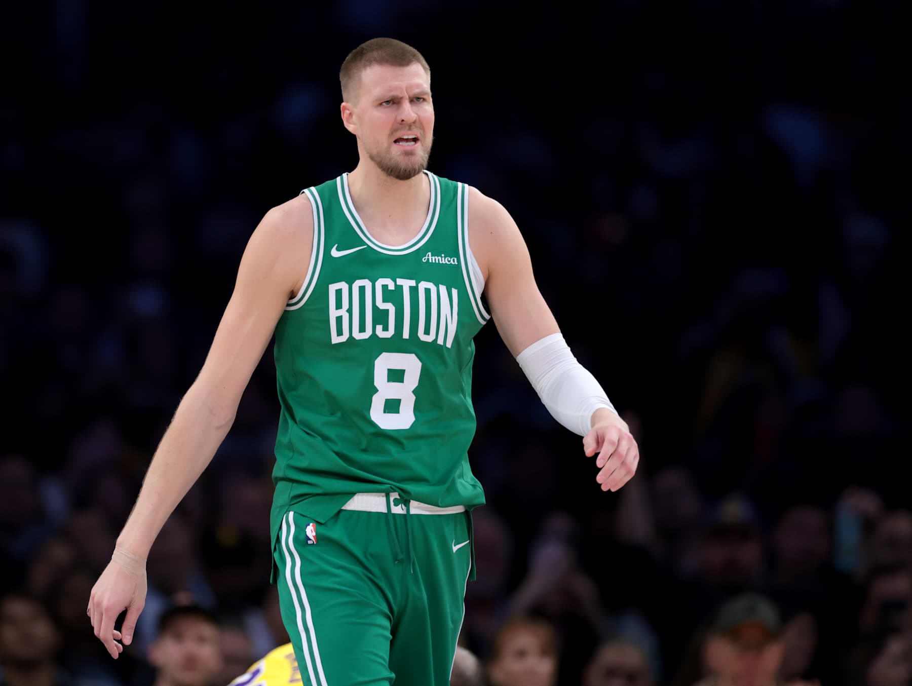 LOS ANGELES, CALIFORNIA - JANUARY 23: Kristaps Porzingis #8 of the Boston Celtics reacts after his foul during a 117-96 loss to the Los Angeles Lakers at Crypto.com Arena on January 23, 2025 in Los Angeles, California. NOTE TO USER: User expressly acknowledges and agrees that, by downloading and or using this photograph, User is consenting to the terms and conditions of the Getty Images License Agreement. (Photo by Harry How/Getty Images)