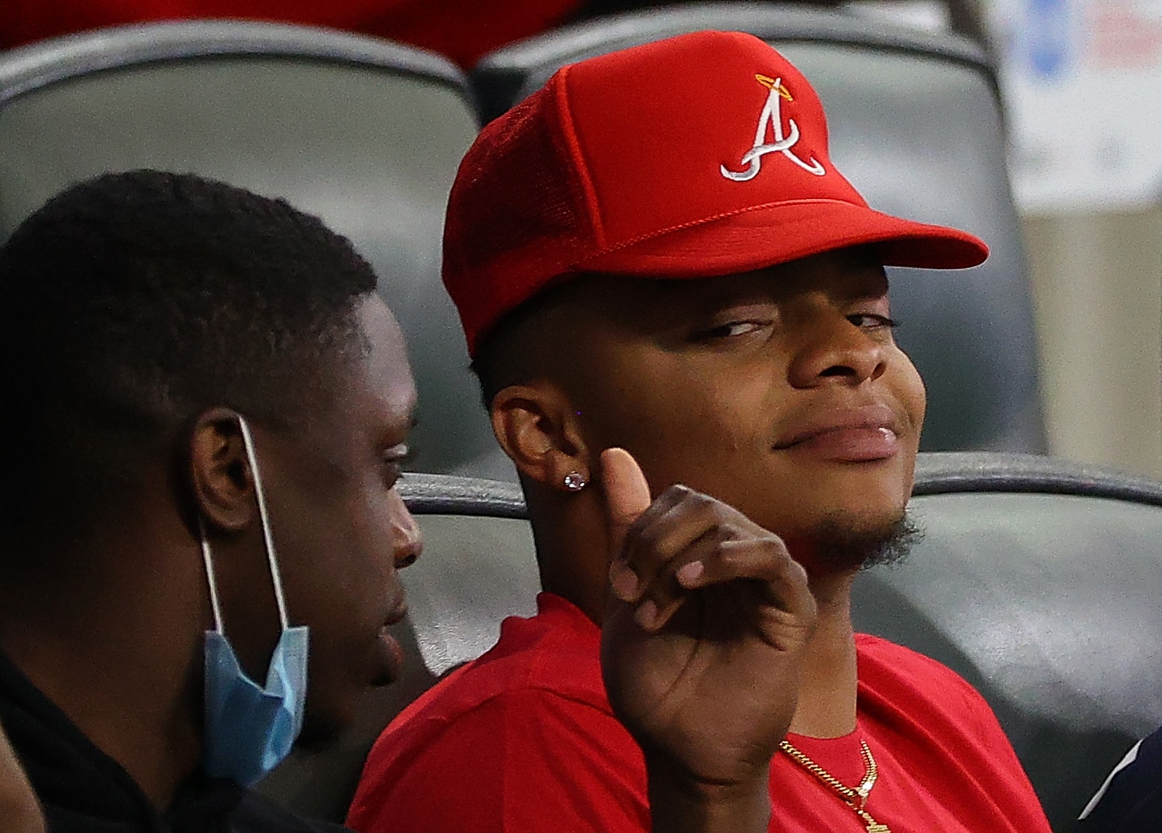 ATLANTA, GEORGIA - APRIL 26:  NFL quarterback prospect Justin Fields watches the game between the Atlanta Braves and the Chicago Cubs at Truist Park on April 26, 2021 in Atlanta, Georgia. (Photo by Kevin C. Cox/Getty Images)