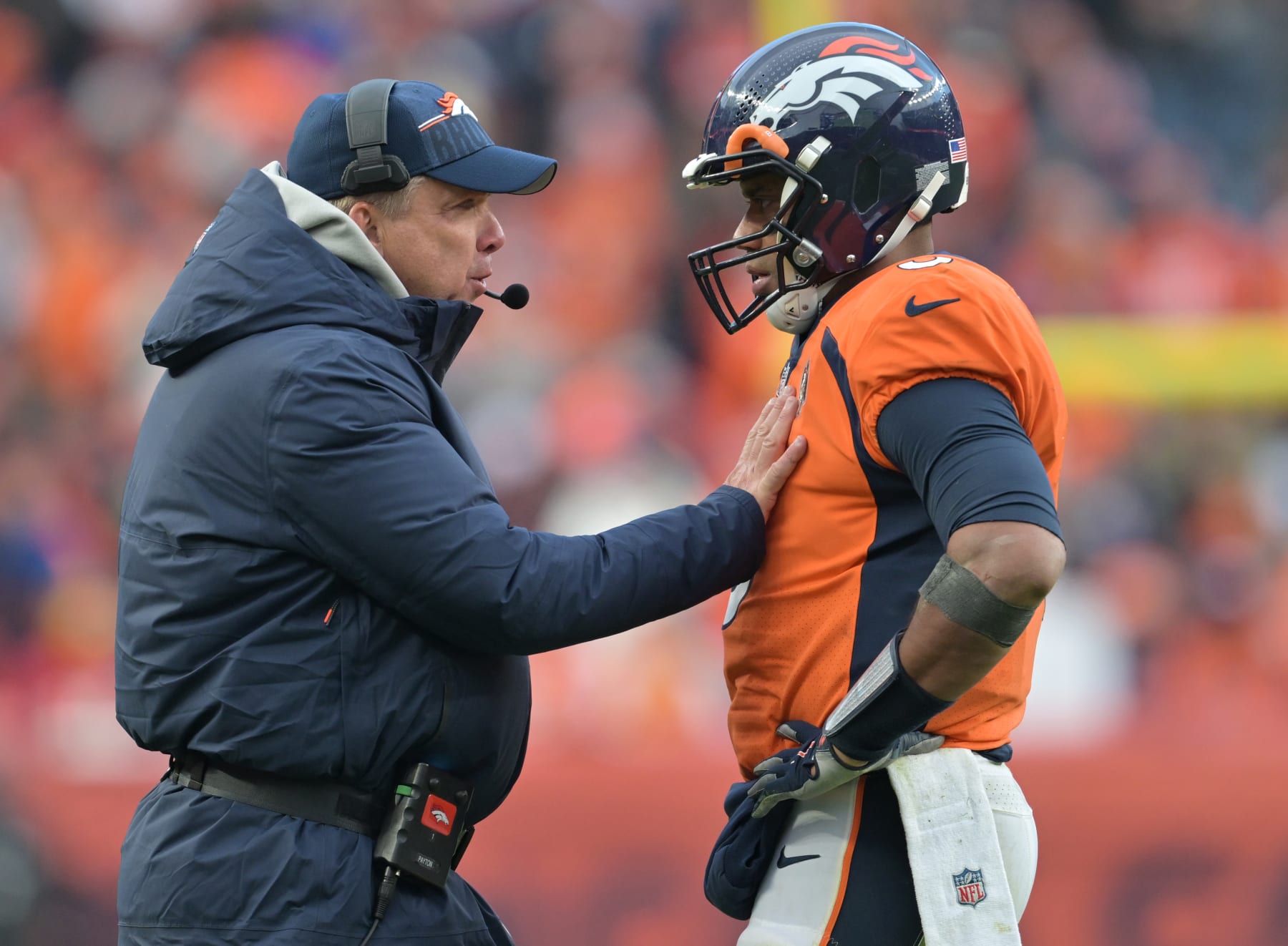 DENVER, COLORADO - OCTOBER 29: Denver Broncos Head coach Sean Payton, left, talks with Denver Broncos quarterback Russell Wilson (3) during the second half at Empower Field at Mile High on October 29, 2023 in Denver, Colorado. The Denver Broncos beat the Kansas City Chiefs 24 to 9 during week 8 of the NFL regular season. (Photo by RJ Sangosti/MediaNews Group/The Denver Post via Getty Images)