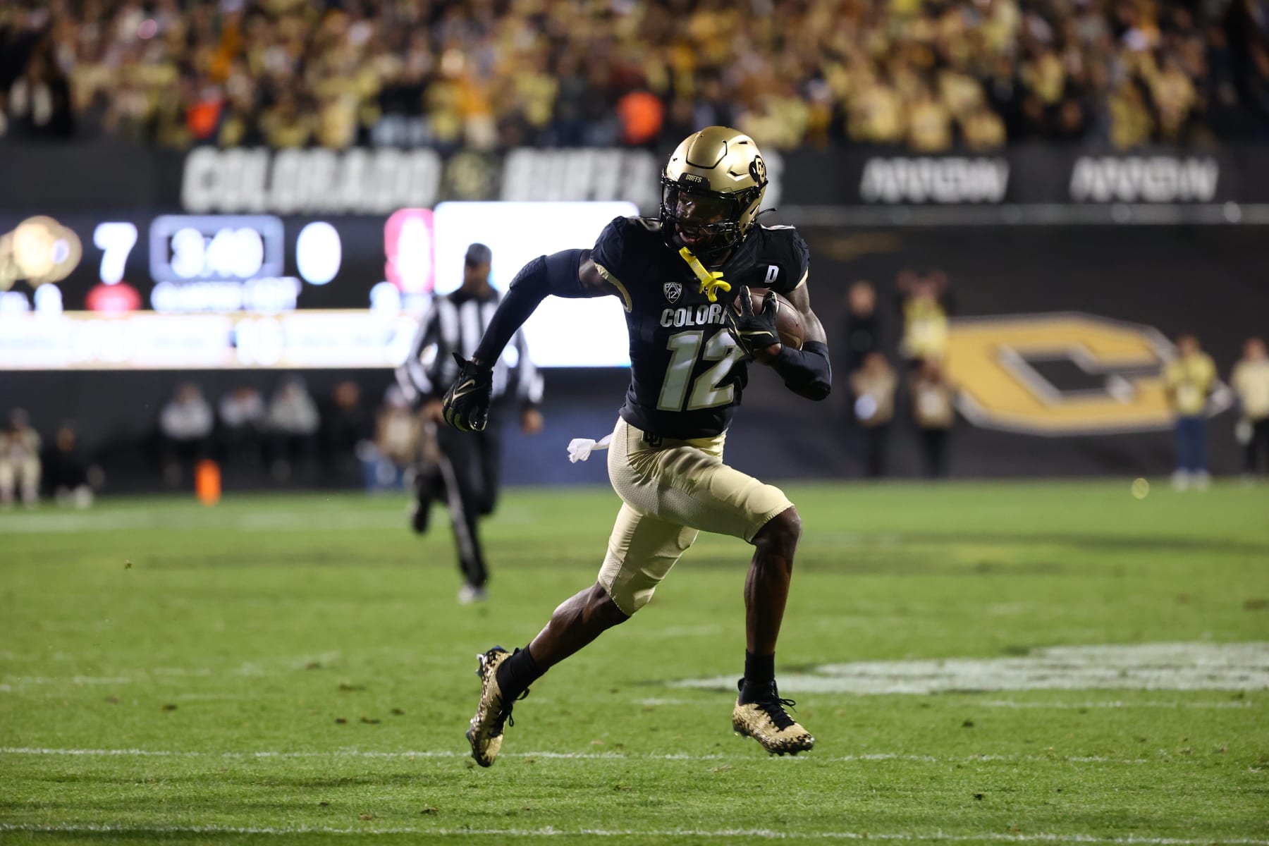 College Football: Colorado receiver Travis Hunter 12) in action, runs with the football vs Stanford at Folsom Field. 
Boulder, CO 10/13/2023 
CREDIT: Jamie Schwaberow (Photo by Jamie Schwaberow/Sports Illustrated via Getty Images) 
(Set Number: X164442)