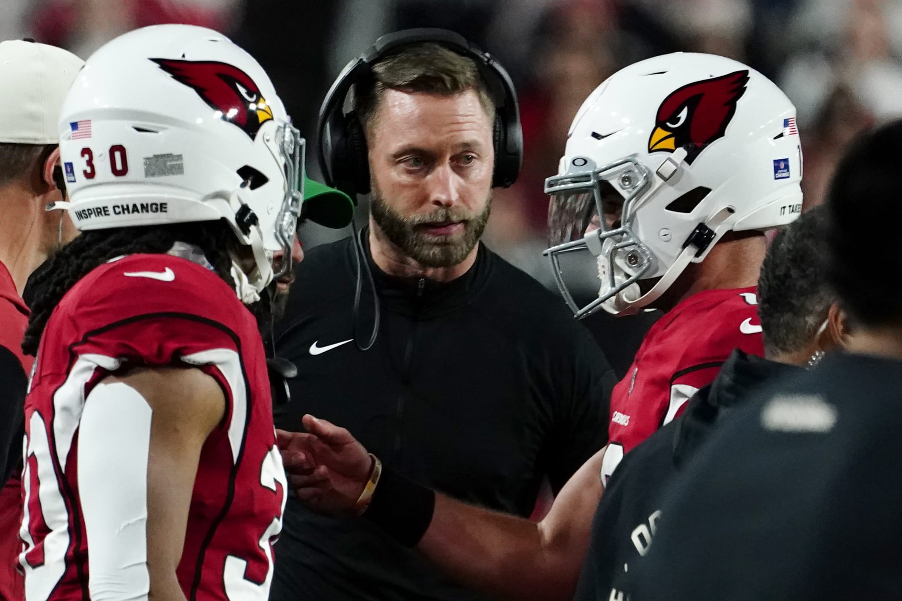 Arizona Cardinals head coach Kliff Kingsbury talks with his players during the first half of an NFL football game agaisnt the Tampa Bay Buccaneers, Sunday, Dec. 25, 2022, in Glendale, Ariz. (AP Photo/Darryl Webb)