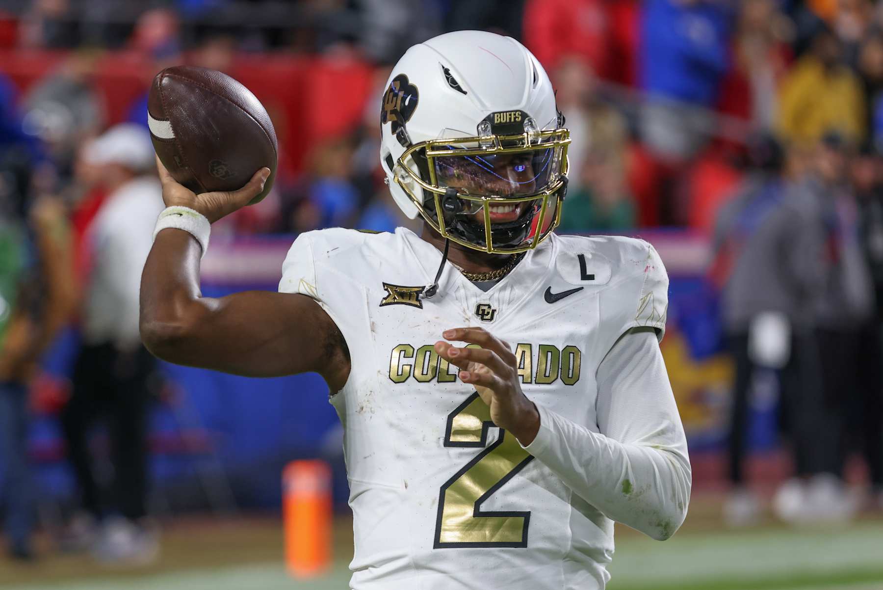 KANSAS CITY, MO - NOVEMBER 23: Colorado Buffaloes quarterback Shedeur Sanders (2) throws a warm up pass between series in the fourth quarter of a Big 12 game between the Colorado Buffaloes and Kansas Jayhawks on November 23, 2024 at GEHA Field at Arrowhead Stadium in Kansas City, MO. (Photo by Scott Winters/Icon Sportswire via Getty Images)