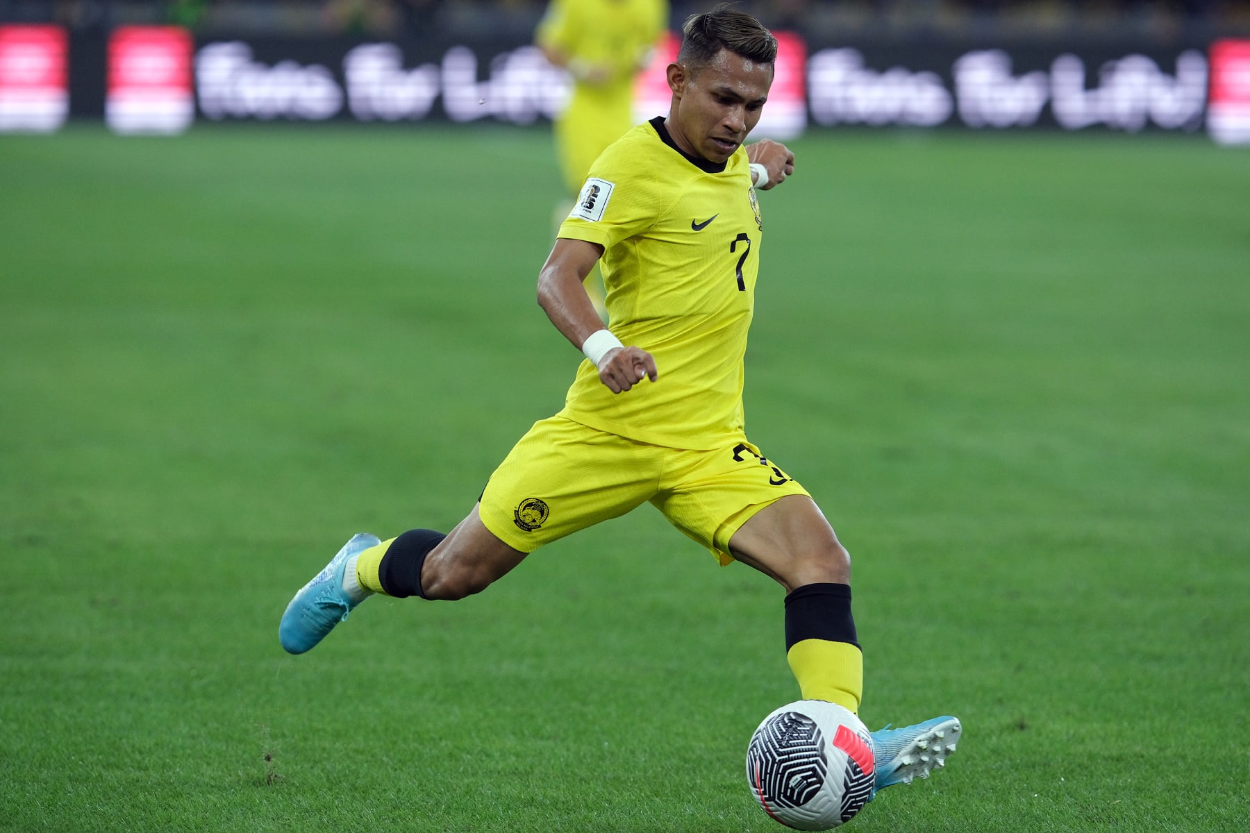 KUALA LUMPUR, MALAYSIA - MARCH 26: Mohamad Faisal Halim of Malaysia passes the ball during the FIFA World Cup Asian 2nd qualifier Group D match between Malaysia and Oman at Bukit Jalil National Stadium on March 26, 2024 in Kuala Lumpur, Malaysia. (Photo by How Foo Yeen/Getty Images)