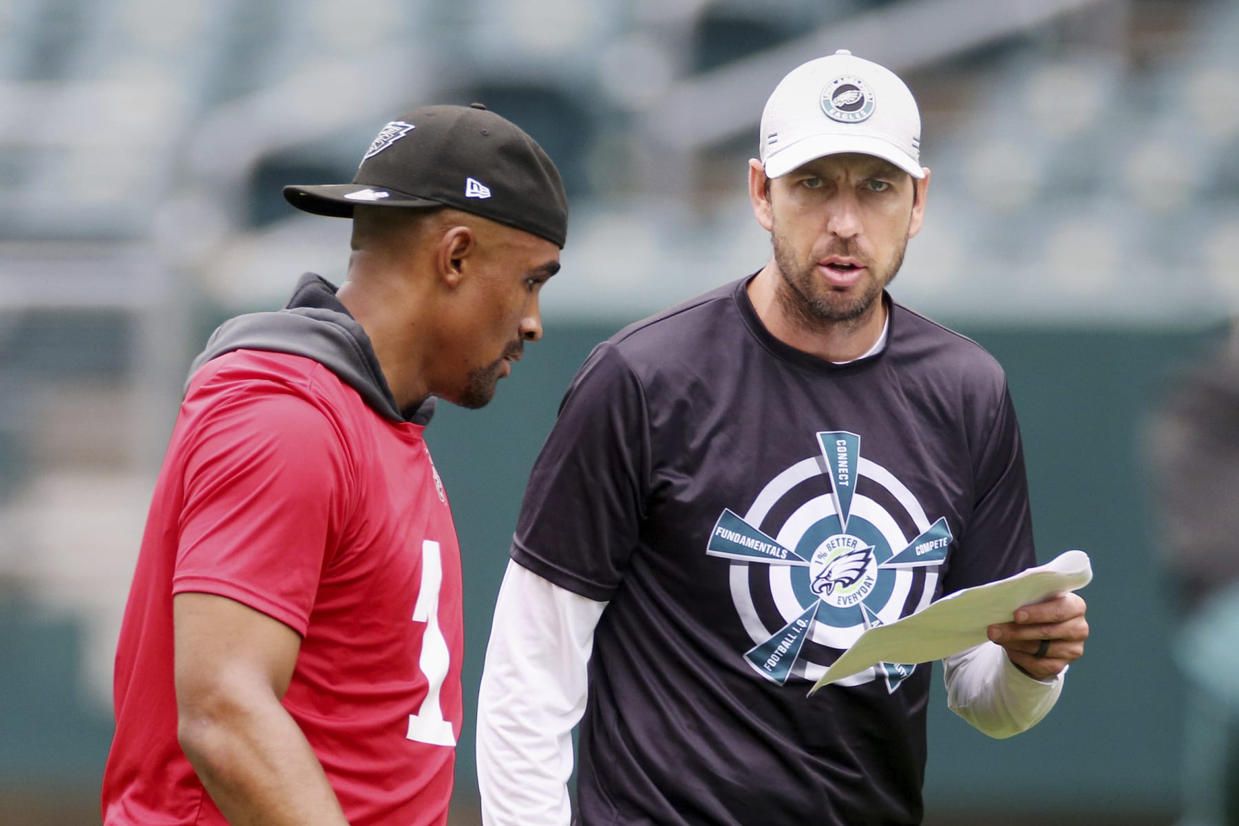 Philadelphia Eagles quarterback Jalen Hurts, left, stands with offensive coordinator Shane Steichen during NFL football practice at Lincoln Financial Field, Friday, June 4, 2021, in Philadelphia. (Tim Tai/The Philadelphia Inquirer via AP, Pool)