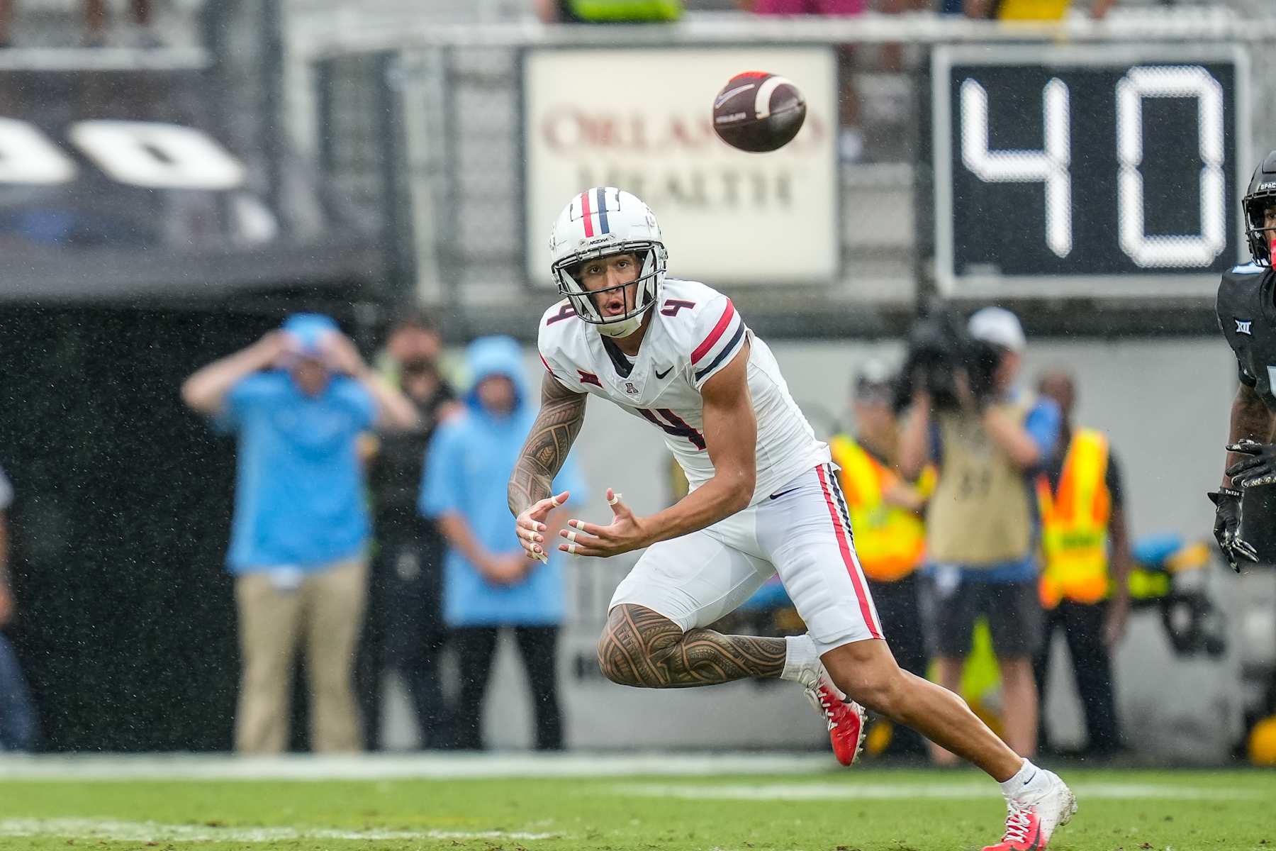 ORLANDO, FL - NOVEMBER 02: Arizona Wildcats wide receiver Tetairoa McMillan (4) prepares to make a play on the ball during a game between the Arizona Wildcats and the UCF Knights on November 02, 2024 at FBC Mortgage Stadium in Orlando, FL (Photo by Ricky Bowden/Icon Sportswire via Getty Images)