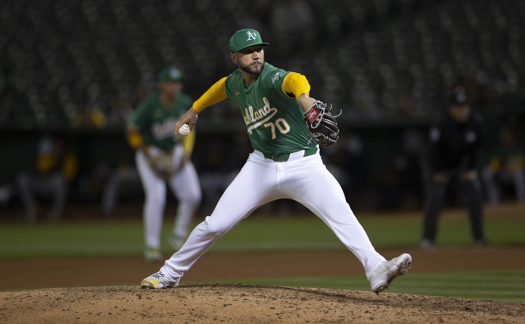 OAKLAND, CA - APRIL 30: Lucas Erceg #70 of the Oakland Athletics pitches during the game against the Pittsburgh Pirates at the Oakland Coliseum on April 30, 2024 in Oakland, California. The Athletics defeated the Pirates 5-2. (Photo by Michael Zagaris/Oakland Athletics/Getty Images)