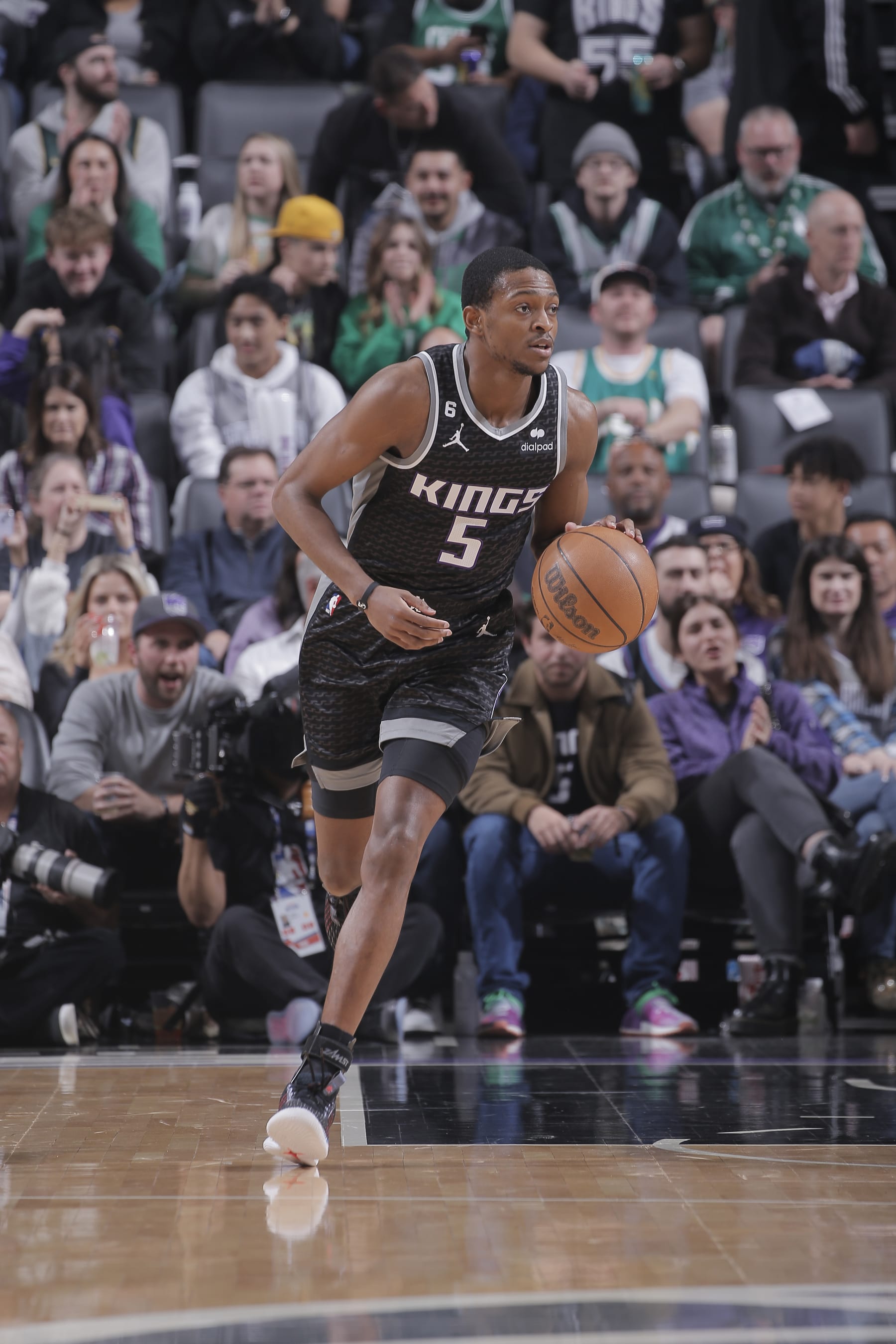 SACRAMENTO, CA - MARCH 21: DeAaron Fox #5 of the Sacramento Kings brings the ball up the court during the game against the Boston Celtics on March 21, 2023 at Golden 1 Center in Sacramento, California. NOTE TO USER: User expressly acknowledges and agrees that, by downloading and or using this photograph, User is consenting to the terms and conditions of the Getty Images Agreement. Mandatory Copyright Notice: Copyright 2023 NBAE (Photo by Rocky Widner/NBAE via Getty Images)