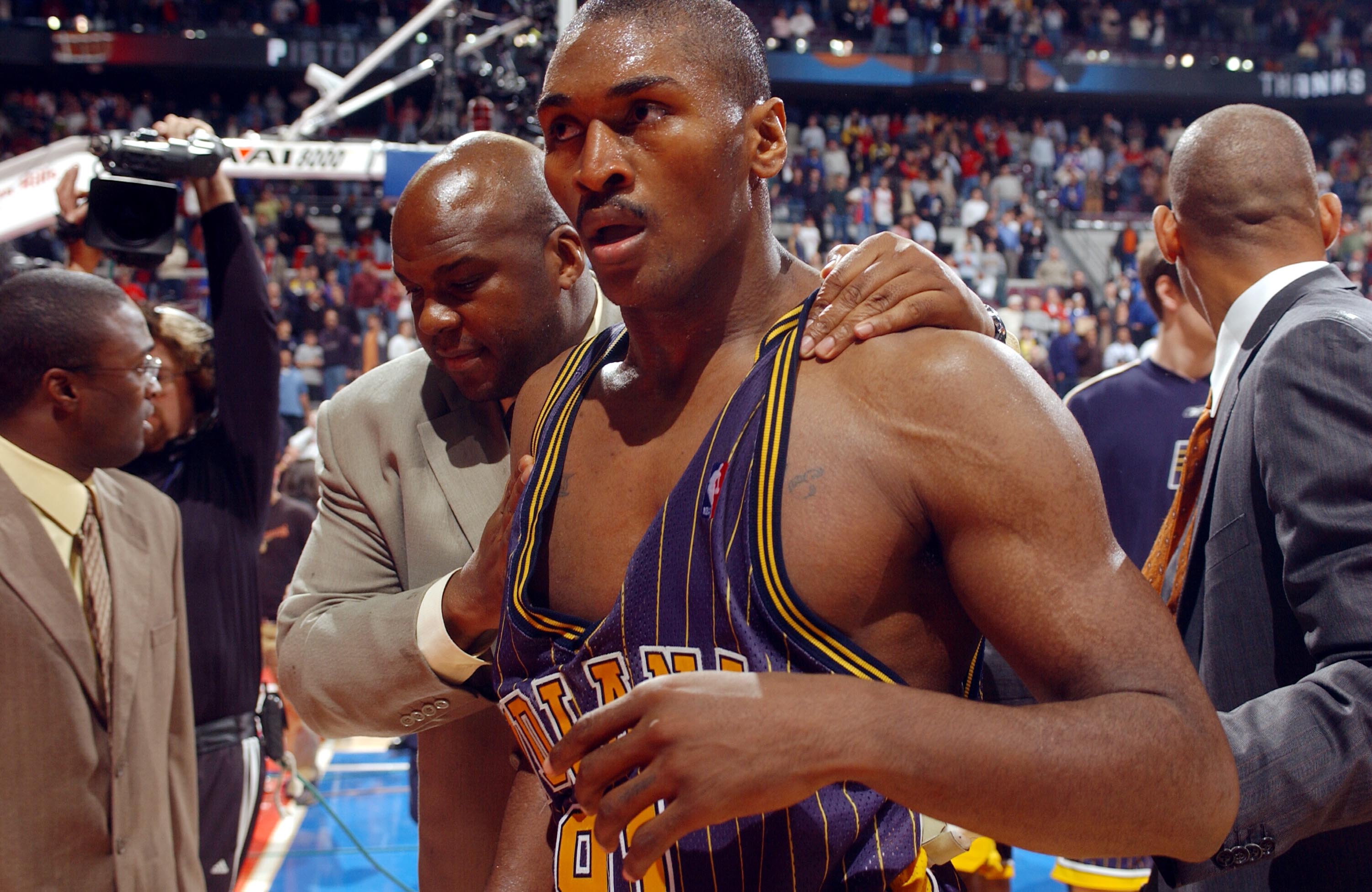 AUBURN HILLS, MI - NOVEMBER 19:  Ron Artest of the Indiana Pacers #91 leaves the floor after a melee involving fans during a game against the Detroit Pistons November 19, 2004 at the Palace of Auburn Hills, in Auburn Hills, Michigan.  NOTE TO USER: User expressly acknowledges and agrees that, by downloading and/or using this Photograph, User is consenting to the terms and conditions of the Getty Images License Agreement. Copyright 2004 NBAE  (Photo by Allen Einstein/NBAE via Getty Images)