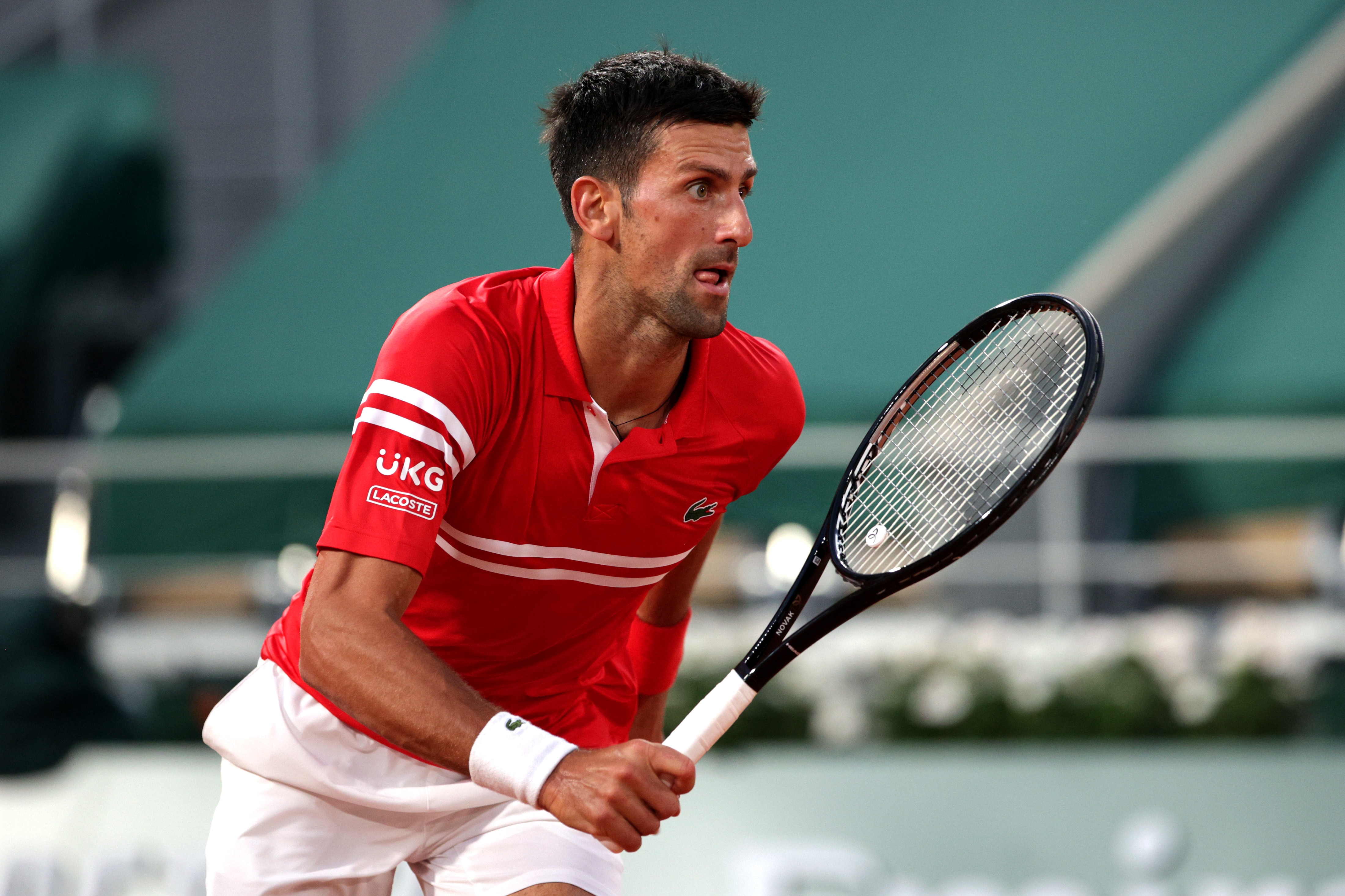 PARIS, FRANCE - JUNE 01: Novak Djokovic of Serbia in their mens first round match against Tennys Sandgren of The United States during day three of the 2021 French Open at Roland Garros on June 01, 2021 in Paris, France. (Photo by Adam Pretty/Getty Images)