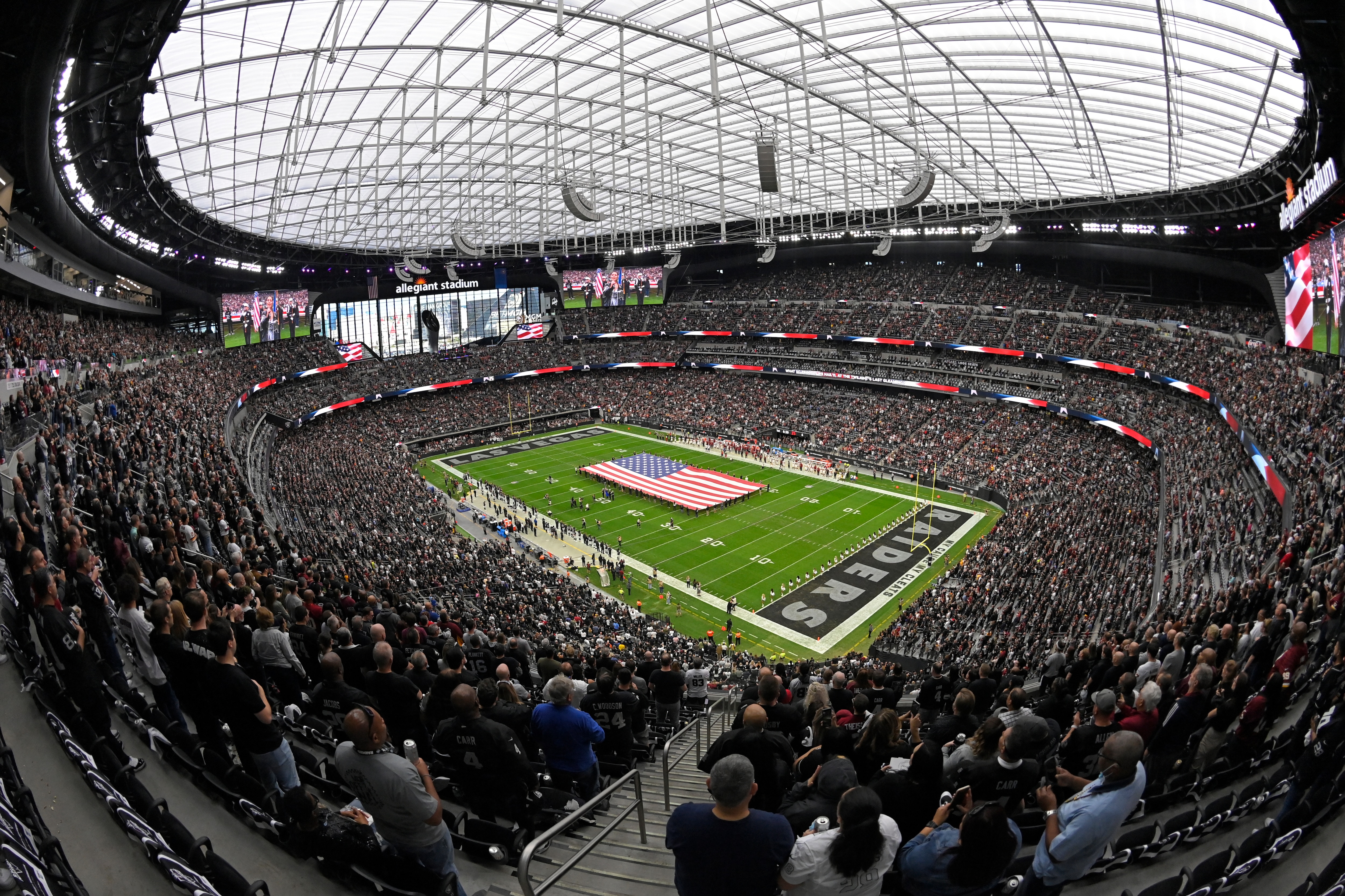 Fans fill Allegiant Stadium before an NFL football game between the Las Vegas Raiders and the Washington Football Team, Sunday, Dec. 5, 2021, in Las Vegas. (AP Photo/David Becker)