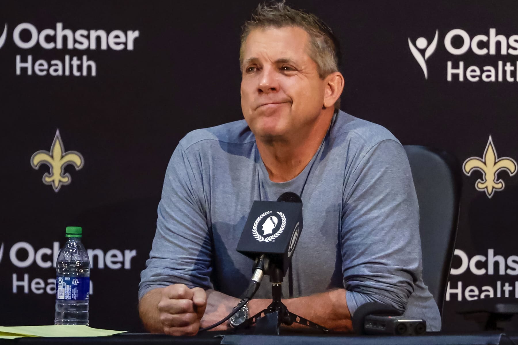 Sean Payton reacts during an NFL football press conference announcing his resignation as head coach of the New Orleans Saints, Tuesday, Jan. 25, 2022, in Metairie, La. (AP Photo/Derick Hingle)