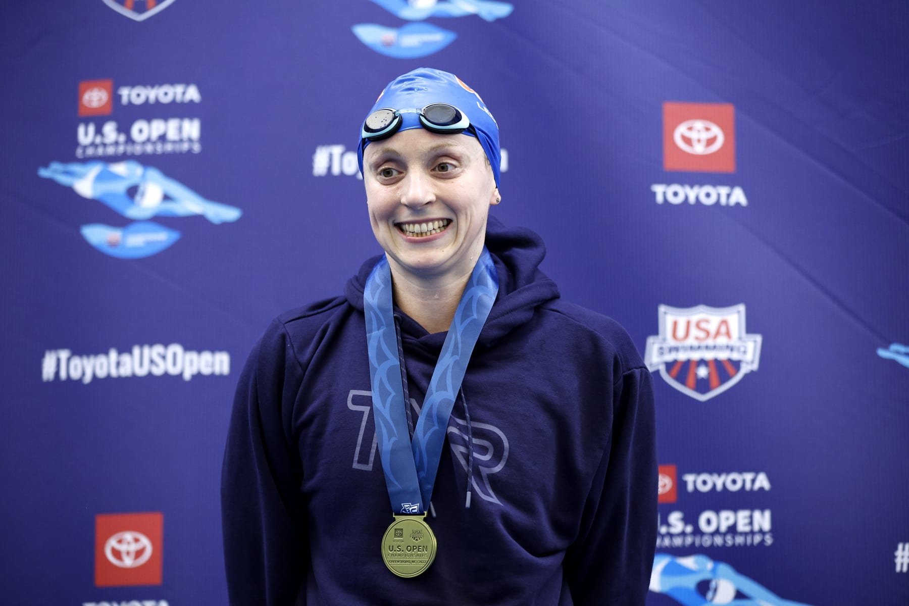 GREENSBORO, NORTH CAROLINA - DECEMBER 03: Katie Ledecky poses with her medal after winning the Women's 1500m Freestyle Final during the Toyota U.S. Open Championships at Greensboro Aquatic Center on December 03, 2022 in Greensboro, North Carolina. (Photo by Jared C. Tilton/Getty Images)