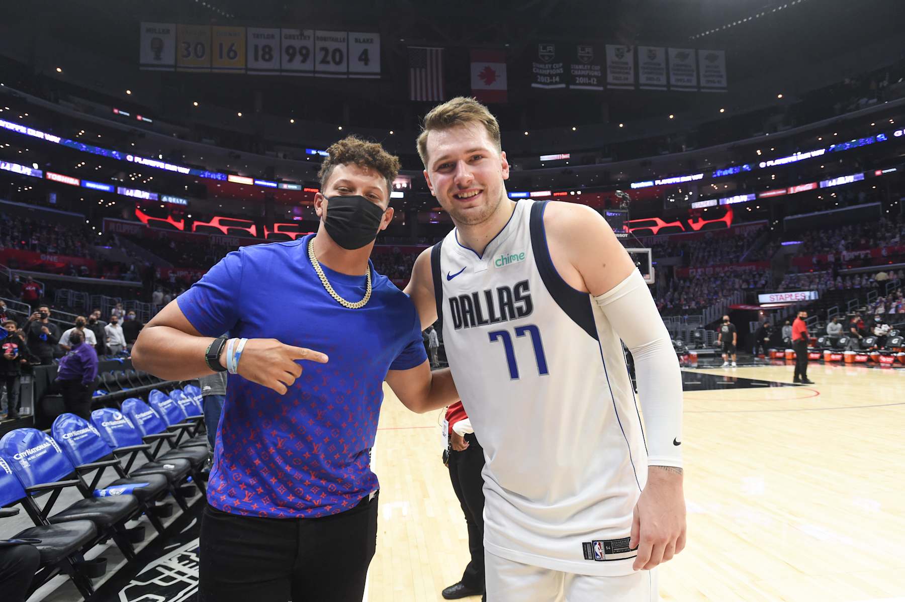 LOS ANGELES, CA - MAY 25: Luka Doncic #77 of the Dallas Mavericks poses with Chiefs Quarterback, Patrick Mahomes after the game against the LA Clippers during Round 1, Game 2 of the 2021 NBA Playoffs on May 25, 2021 at STAPLES Center in Los Angeles, California. NOTE TO USER: User expressly acknowledges and agrees that, by downloading and/or using this Photograph, user is consenting to the terms and conditions of the Getty Images License Agreement. Mandatory Copyright Notice: Copyright 2021 NBAE (Photo by Juan Ocampo/NBAE via Getty Images)