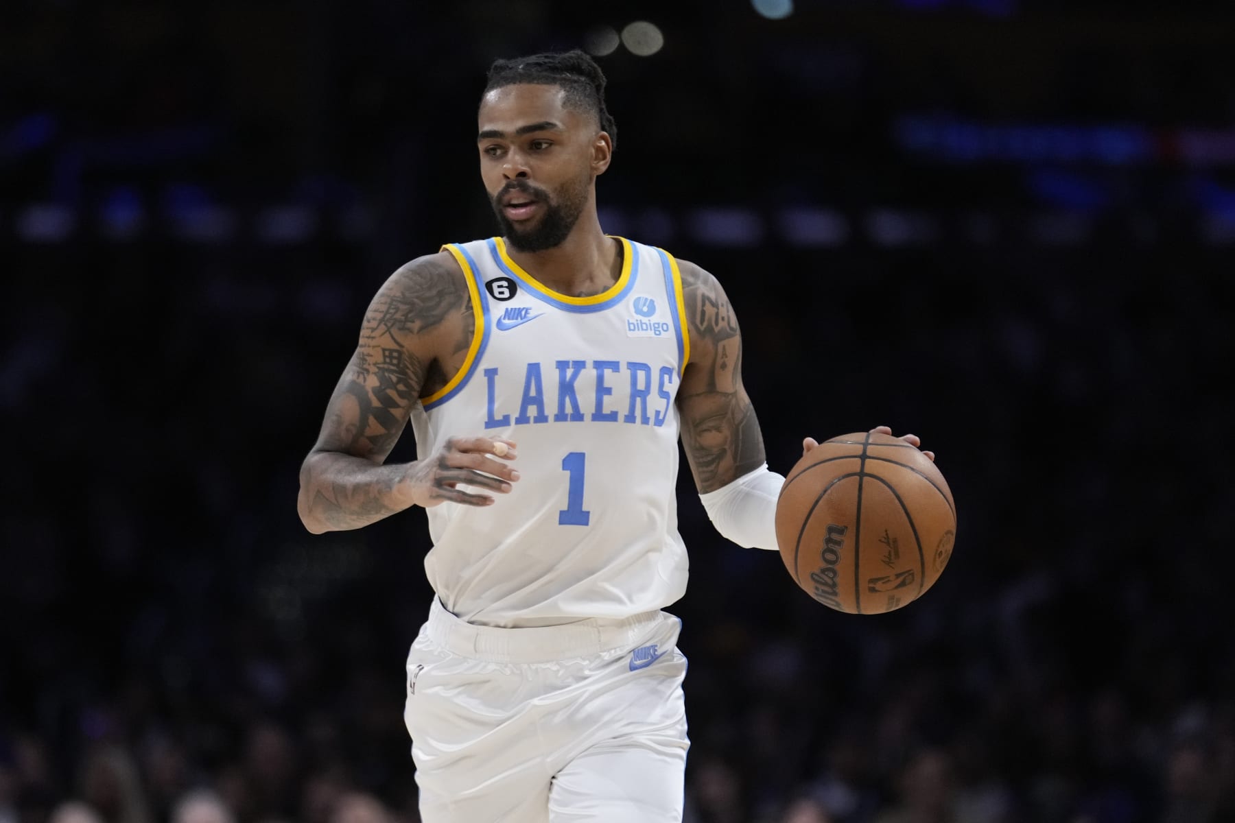 Los Angeles Lakers guard D'Angelo Russell (1) dribbles against the New York Knicks during the first half of an NBA basketball game Sunday, March 12, 2023, in Los Angeles. (AP Photo/Marcio Jose Sanchez)