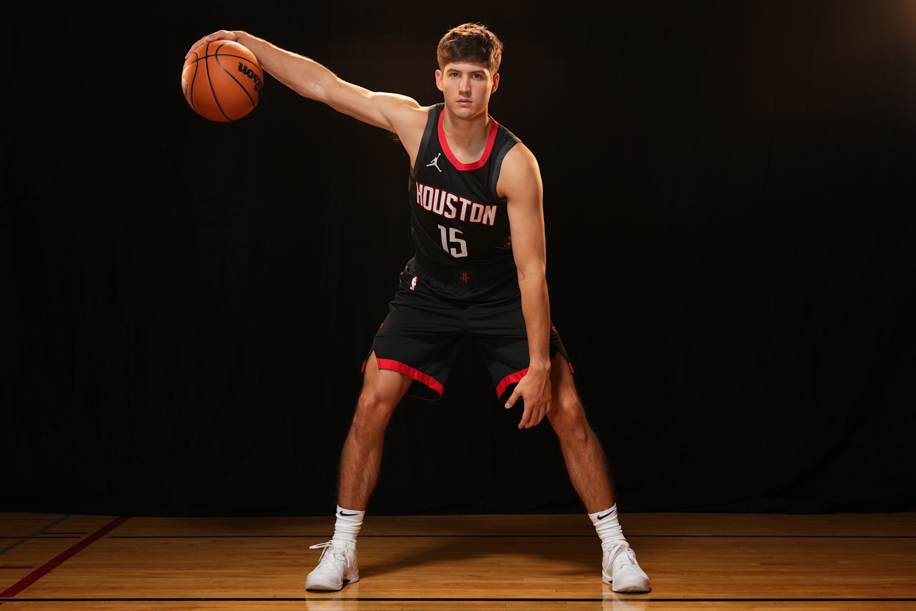 LAS VEGAS, NV - JULY 16: Reed Sheppard #15 of the Houston Rockets poses for a portrait during the 2024 NBA Rookie Photo Shoot on July 16, 2024 at the University of Nevada, Las Vegas campus in Las Vegas, Nevada. NOTE TO USER: User expressly acknowledges and agrees that, by downloading and/or using this Photograph, user is consenting to the terms and conditions of the Getty Images License Agreement. Mandatory Copyright Notice: Copyright 2024 NBAE (Photo by Jeff Bottari/NBAE via Getty Images)