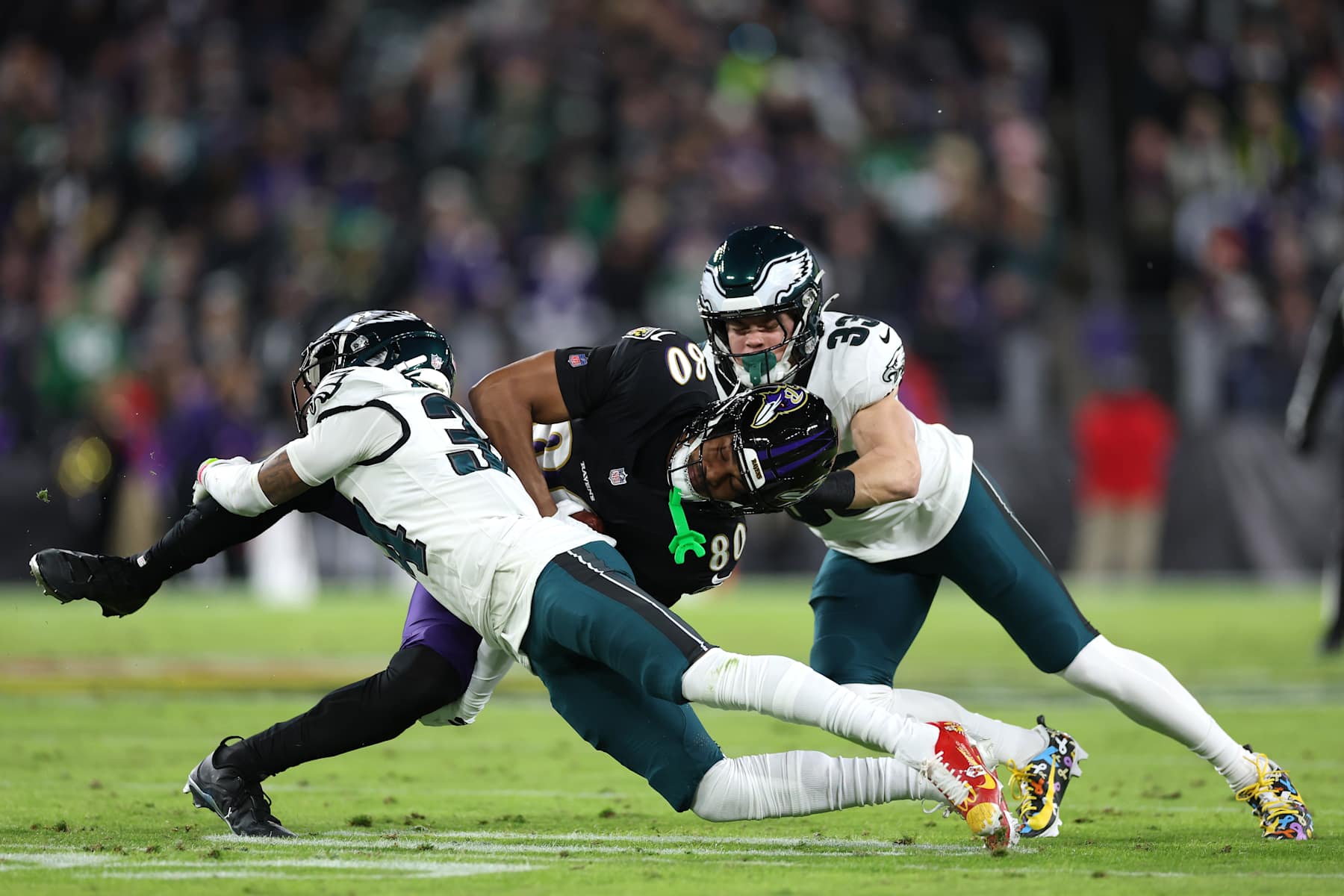 Philadelphia Eagles defense making a stop against Baltimore Ravens tight end Isaiah Likely. 