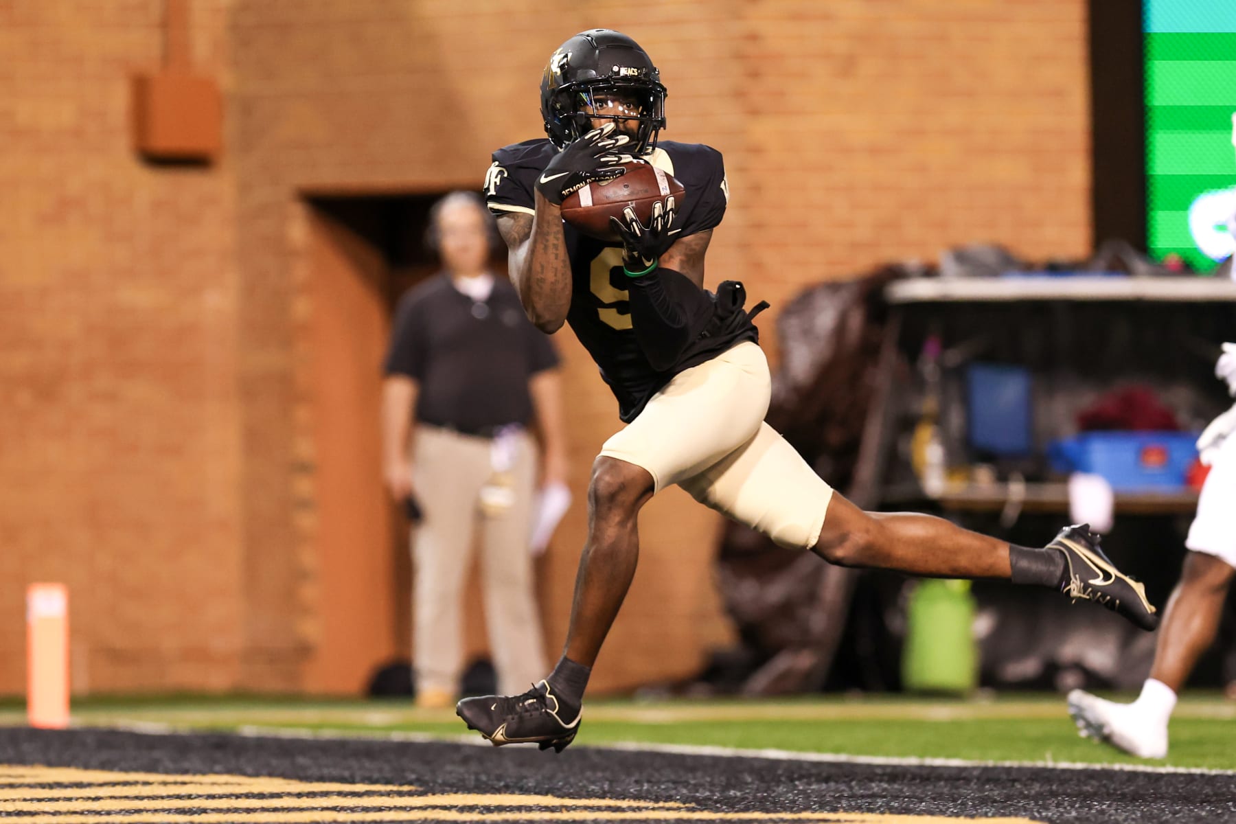 WINSTON-SALEM, NC - NOVEMBER 12: A.T. Perry (9) of the Wake Forest Demon Deacons catches a touchdown pass during a football game between the Wake Forest Demon Deacons and the North Carolina Tar Heels on Nov 12, 2022 at Truist Field in Winston-Salem, NC. (Photo by David Jensen/Icon Sportswire via Getty Images)