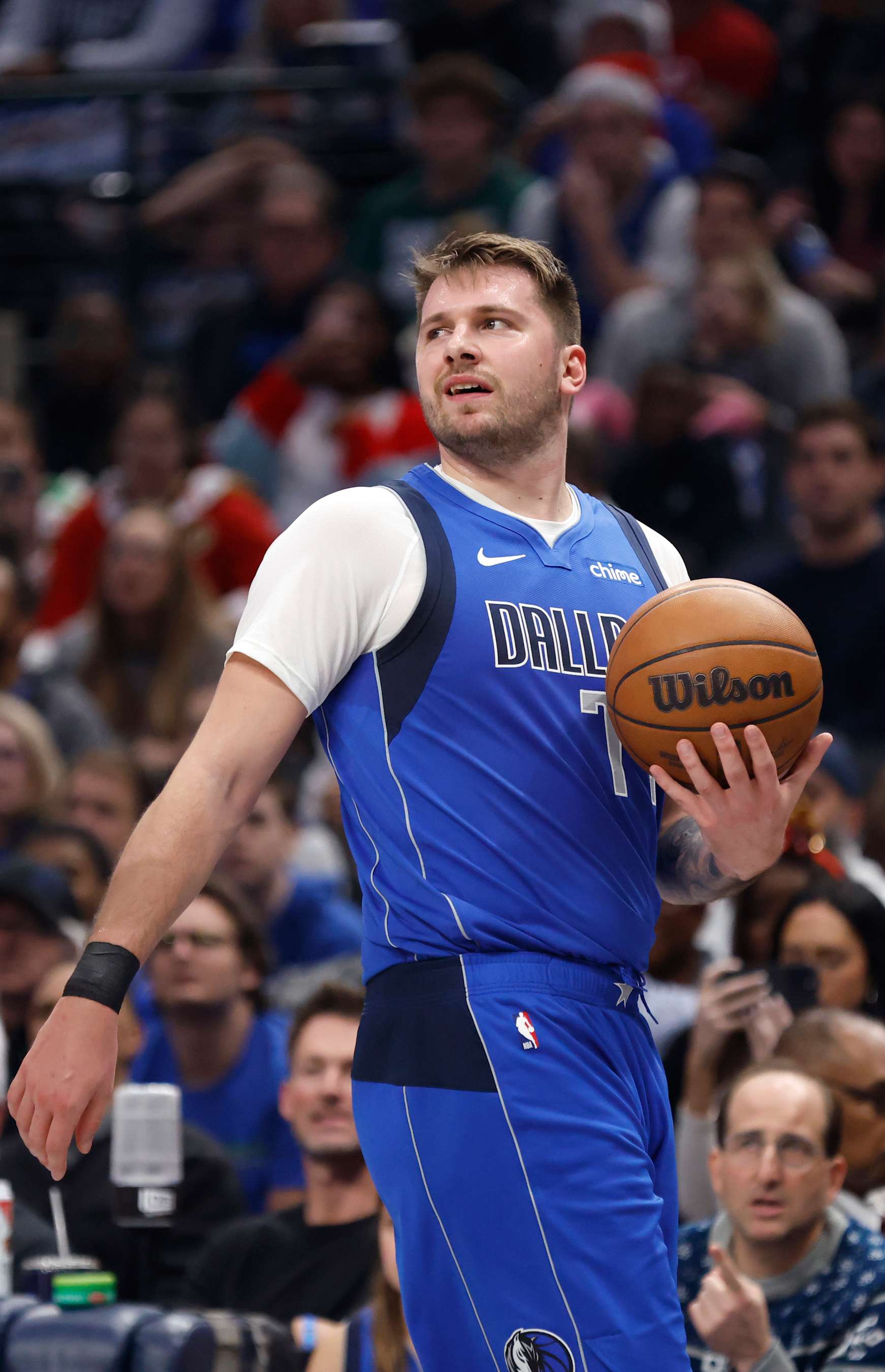 DALLAS, TX -DECEMBER 25 : Luka Doncic #77 of the Dallas Mavericks looks on against the Minnesota Timberwolves in the first half at American Airlines Center on December 25, 2024 in Dallas, Texas. NOTE TO USER: User expressly acknowledges and agrees that, by downloading and or using this photograph, User is consenting to the terms and conditions of the Getty Images License Agreement. (Photo by Ron Jenkins/Getty Images)