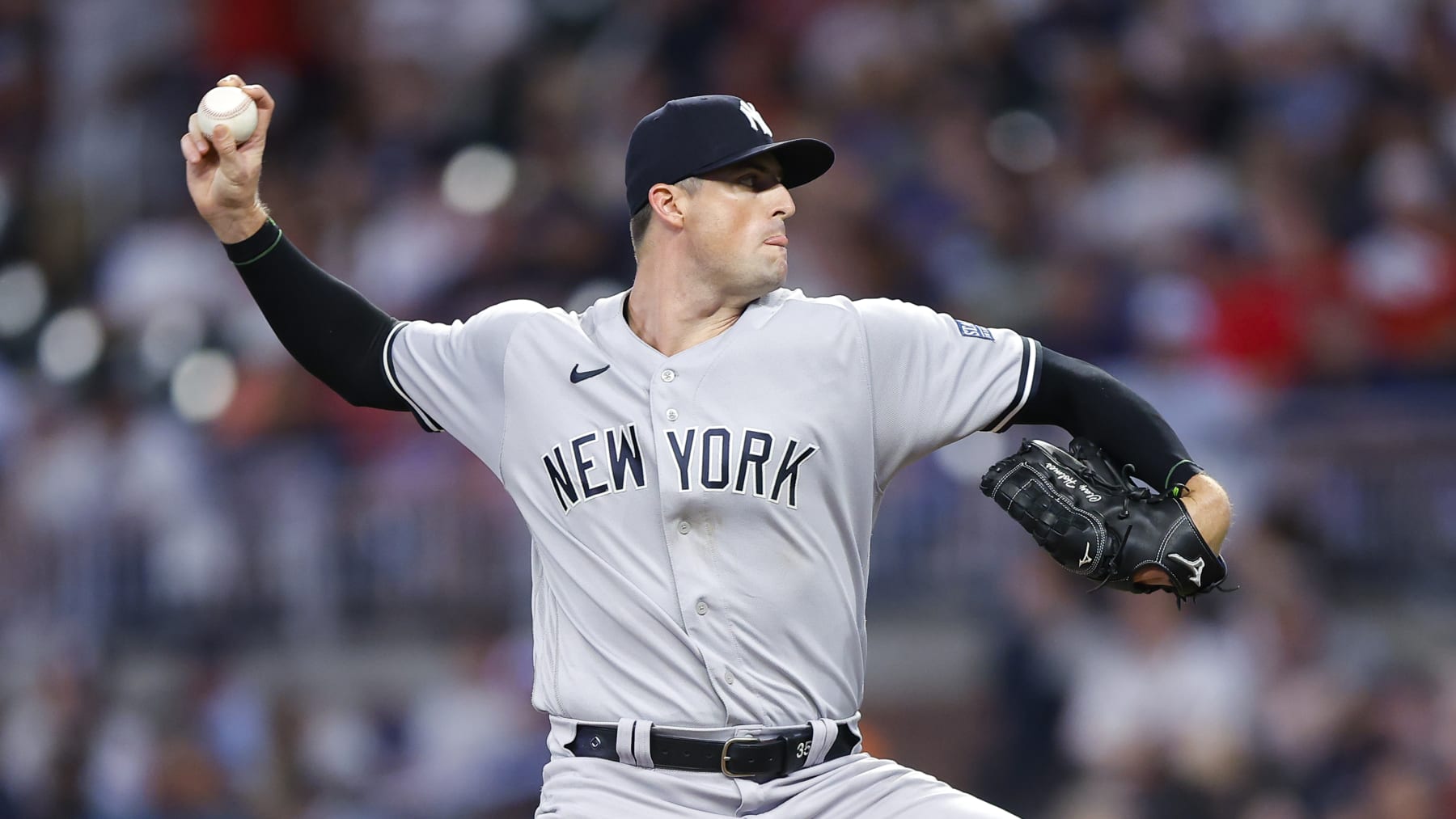 ATLANTA, GEORGIA - AUGUST 15: Clay Holmes #35 of the New York Yankees pitches during the eighth inning against the Atlanta Braves at Truist Park on August 15, 2023 in Atlanta, Georgia. (Photo by Todd Kirkland/Getty Images)