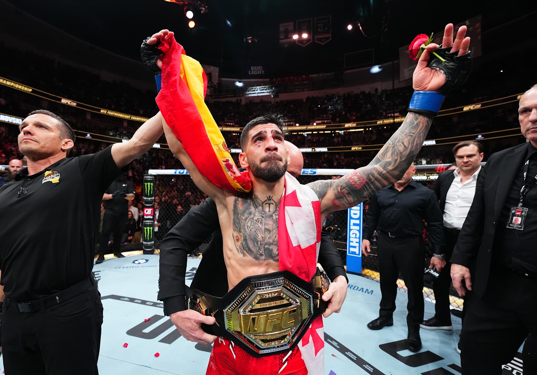 ANAHEIM, CALIFORNIA - FEBRUARY 17: Ilia Topuria of Germany celebrates after his knockout victory against Alexander Volkanovski of Australia in the UFC featherweight championship fight during the UFC 298 event at Honda Center on February 17, 2024 in Anaheim, California. (Photo by Chris Unger/Zuffa LLC via Getty Images)