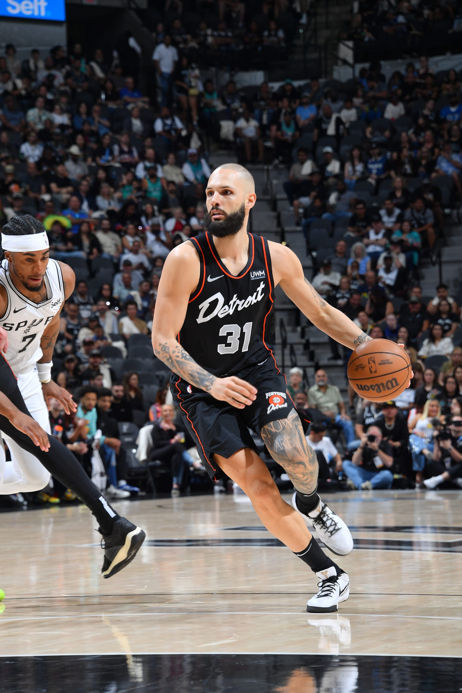 SAN ANTONIO, TX - APRIL 14: Evan Fournier #31 of the Detroit Pistons  dribbles the ball during the game against the San Antonio Spurs on April 14, 2024 at the Frost Bank Center in San Antonio, Texas. NOTE TO USER: User expressly acknowledges and agrees that, by downloading and or using this photograph, user is consenting to the terms and conditions of the Getty Images License Agreement. Mandatory Copyright Notice: Copyright 2024 NBAE (Photos by Michael Gonzales/NBAE via Getty Images)