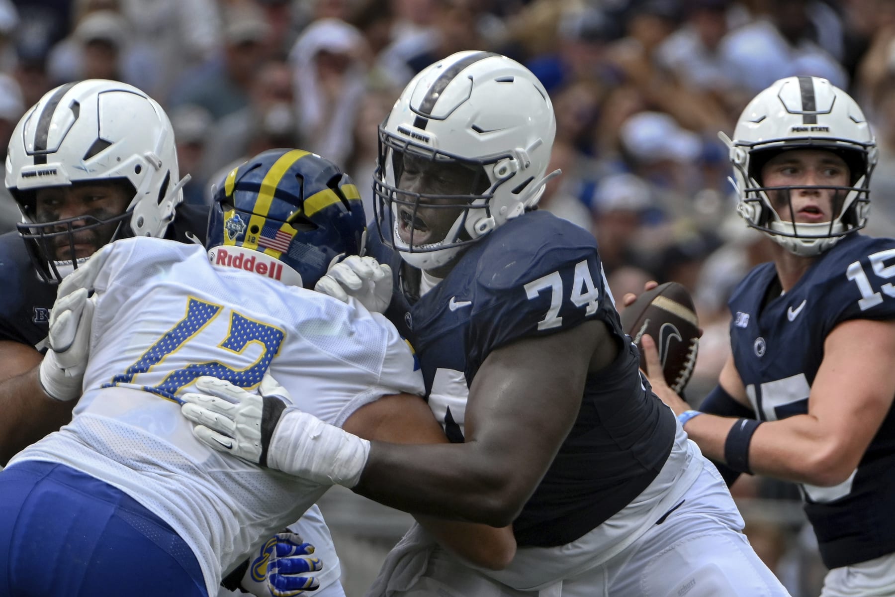 Penn State offensive lineman Olumuyiwa Fashanu (74) blocks Delaware defensive end Chase McGowan (12) during the first half of an NCAA college football game, Saturday, Sept. 9, 2023, in State College, Pa. (AP Photo/Barry Reeger)
