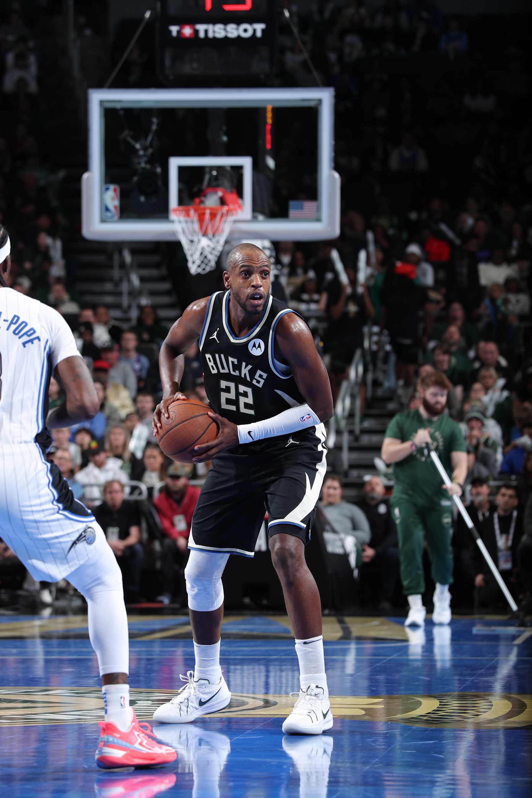 MILWAUKEE, WI - DECEMBER 10: Khris Middleton #22 of the Milwaukee Bucks handles the ball during the game against the Orlando Magic during the Emirates NBA Cup Quarterfinals on December 10, 2024 at Fiserv Forum Center in Milwaukee, Wisconsin. NOTE TO USER: User expressly acknowledges and agrees that, by downloading and or using this Photograph, user is consenting to the terms and conditions of the Getty Images License Agreement. Mandatory Copyright Notice: Copyright 2024 NBAE (Photo by Gary Dineen/NBAE via Getty Images).