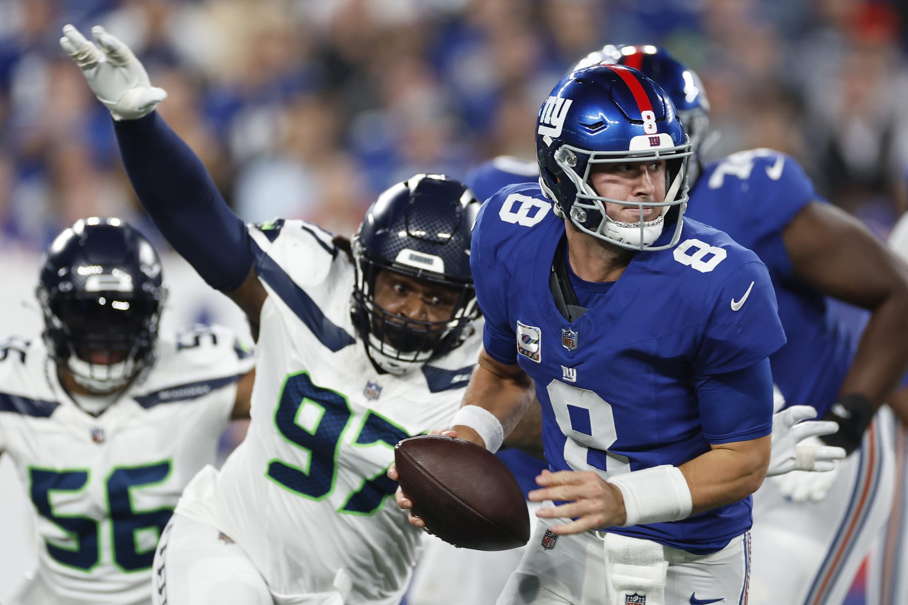 EAST RUTHERFORD, NEW JERSEY - OCTOBER 02: Daniel Jones #8 of the New York Giants has the ball stripped by Mario Edwards Jr. #97 of the Seattle Seahawks during the first quarter at MetLife Stadium on October 02, 2023 in East Rutherford, New Jersey. (Photo by Sarah Stier/Getty Images)