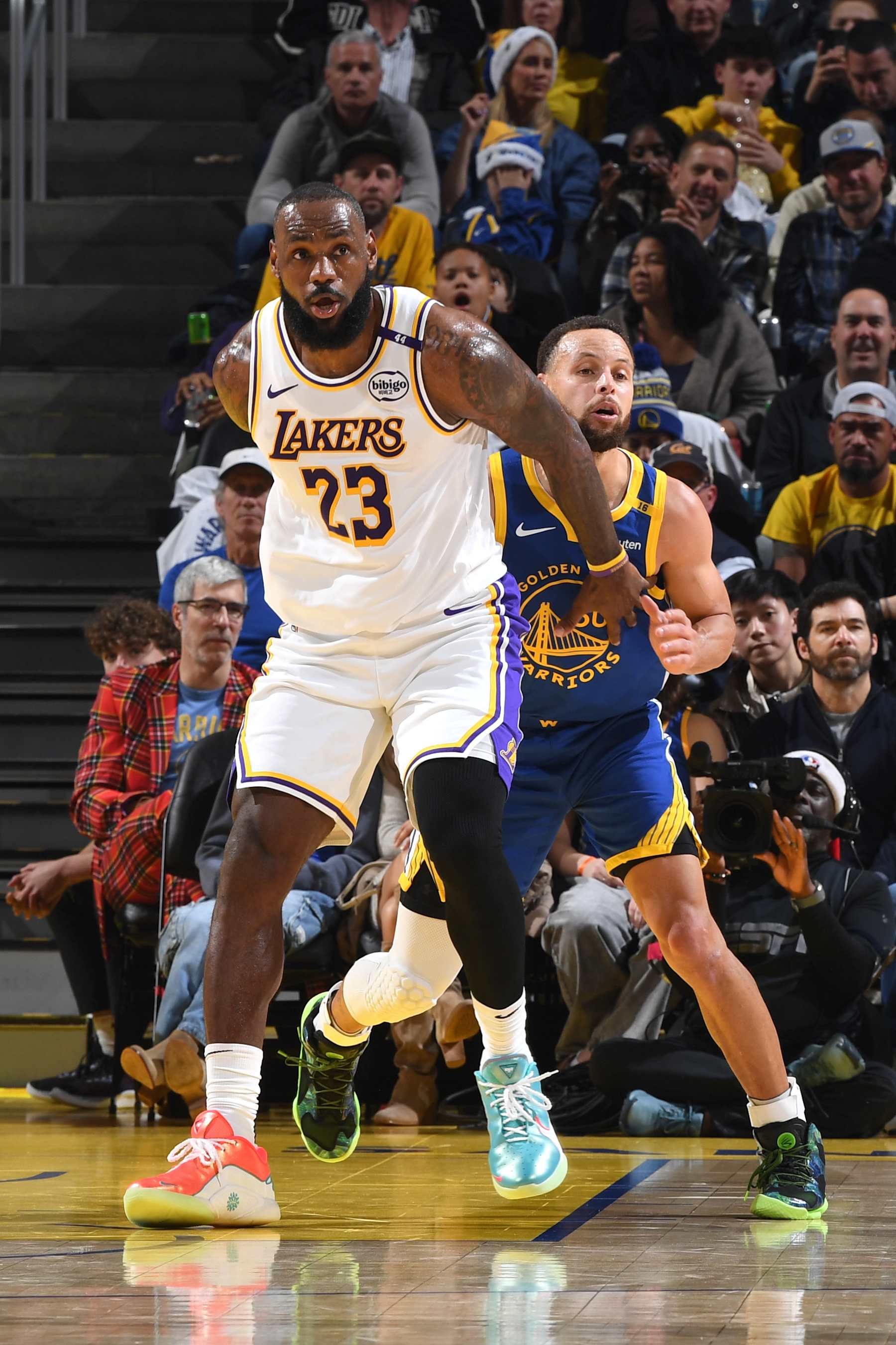 SAN FRANCISCO, CA - DECEMBER 25: Stephen Curry #30 of the Golden State Warriors and LeBron James #23 of the Los Angeles Lakers look on during the game on December 25, 2024 at Chase Center in San Francisco, California. NOTE TO USER: User expressly acknowledges and agrees that, by downloading and or using this photograph, user is consenting to the terms and conditions of Getty Images License Agreement. Mandatory Copyright Notice: Copyright 2024 NBAE (Photo by Noah Graham/NBAE via Getty Images)