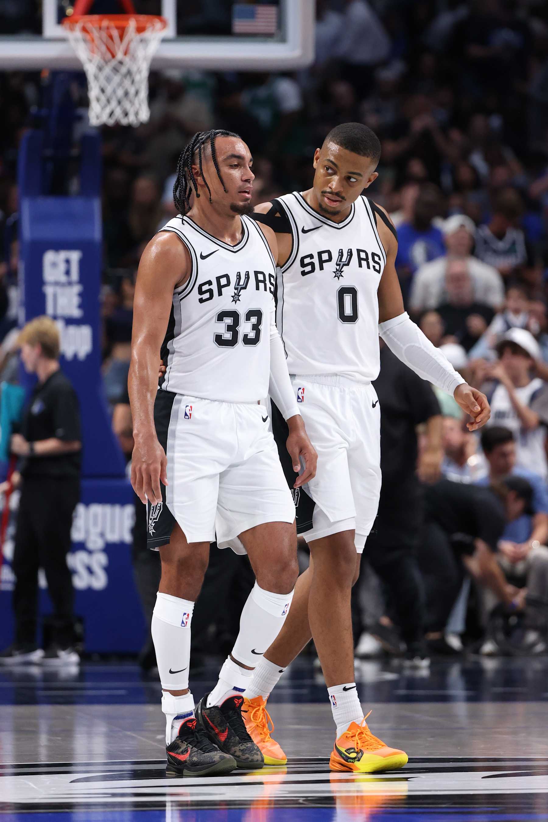 DALLAS, TX - OCTOBER 24: Tre Jones #33 and Keldon Johnson #0 of the San Antonio Spurs look on during the game against the Dallas Mavericks on October 24, 2024 at American Airlines Center in Dallas, Texas. NOTE TO USER: User expressly acknowledges and agrees that, by downloading and or using this photograph, User is consenting to the terms and conditions of the Getty Images License Agreement. Mandatory Copyright Notice: Copyright 2024 NBAE (Photo by Joe Murphy/NBAE via Getty Images)