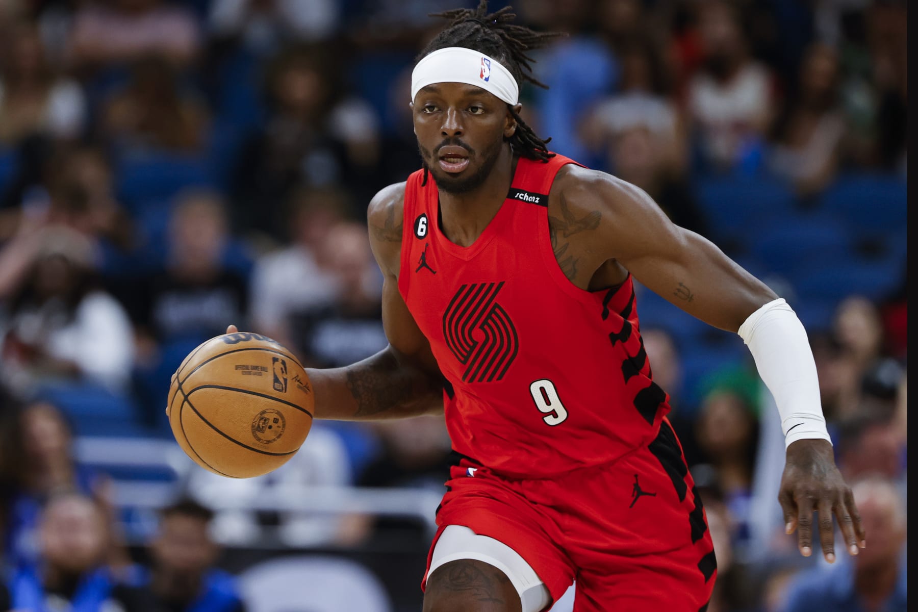 Portland Trail Blazers forward Jerami Grant (9) brings the ball down court against the Orlando Magic during the first half of an NBA basketball game, Sunday, March 5, 2023, in Orlando, Fla. (AP Photo/Kevin Kolczynski)
