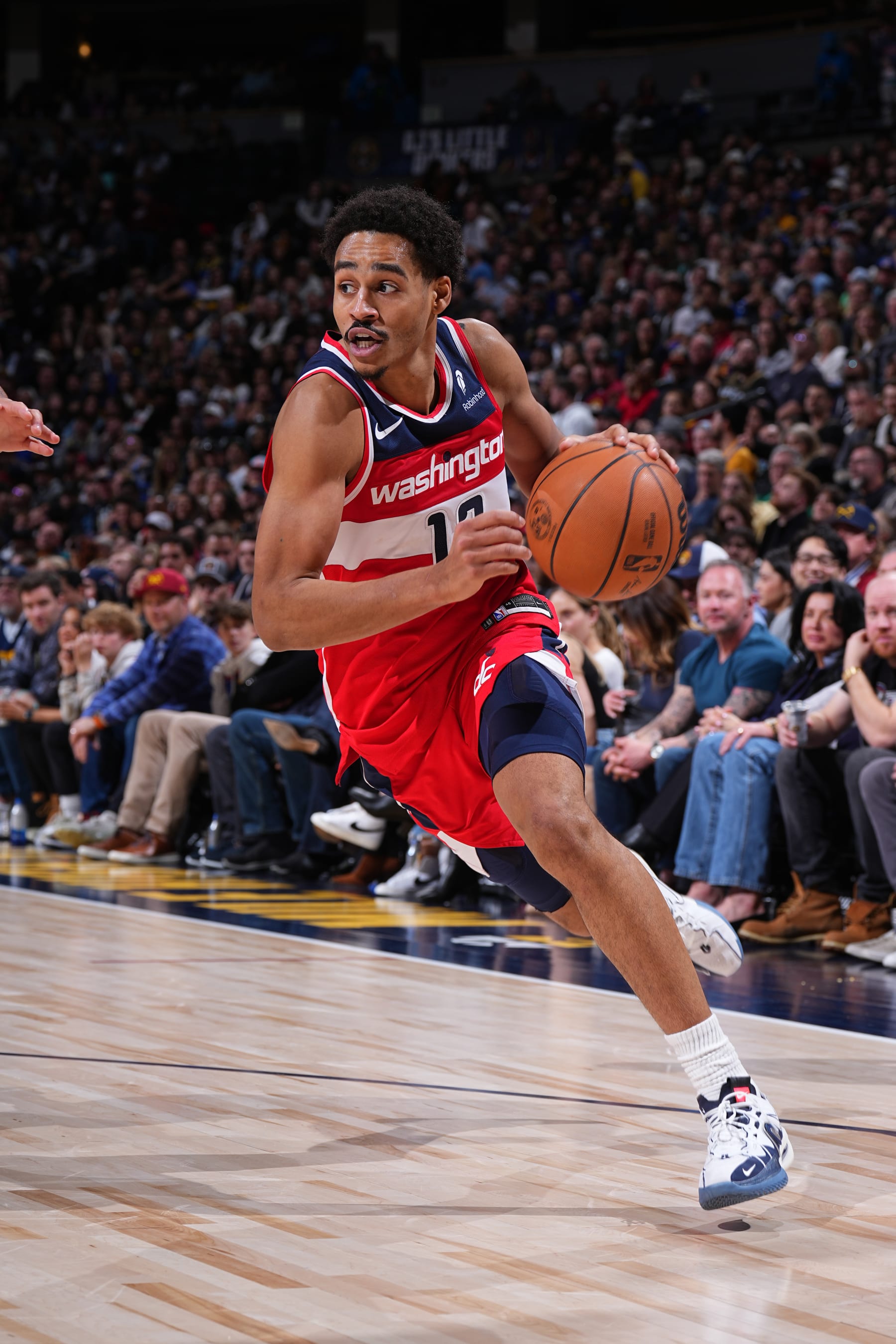 DENVER, CO - FEBRUARY 22: Jordan Poole #13 of the Washington Wizards dribbles the ball during the game against the Denver Nuggets on February 22, 2024 at the Ball Arena in Denver, Colorado. NOTE TO USER: User expressly acknowledges and agrees that, by downloading and/or using this Photograph, user is consenting to the terms and conditions of the Getty Images License Agreement. Mandatory Copyright Notice: Copyright 2024 NBAE (Photo by Garrett Ellwood/NBAE via Getty Images)