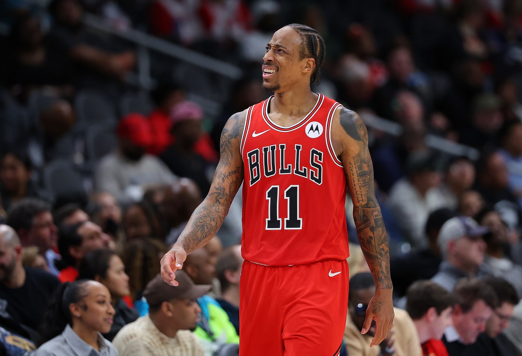 ATLANTA, GEORGIA - FEBRUARY 12:  DeMar DeRozan #11 of the Chicago Bulls reacts against the Atlanta Hawks during the fourth quarter at State Farm Arena on February 12, 2024 in Atlanta, Georgia.  NOTE TO USER: User expressly acknowledges and agrees that, by downloading and/or using this photograph, user is consenting to the terms and conditions of the Getty Images License Agreement.  (Photo by Kevin C. Cox/Getty Images)
