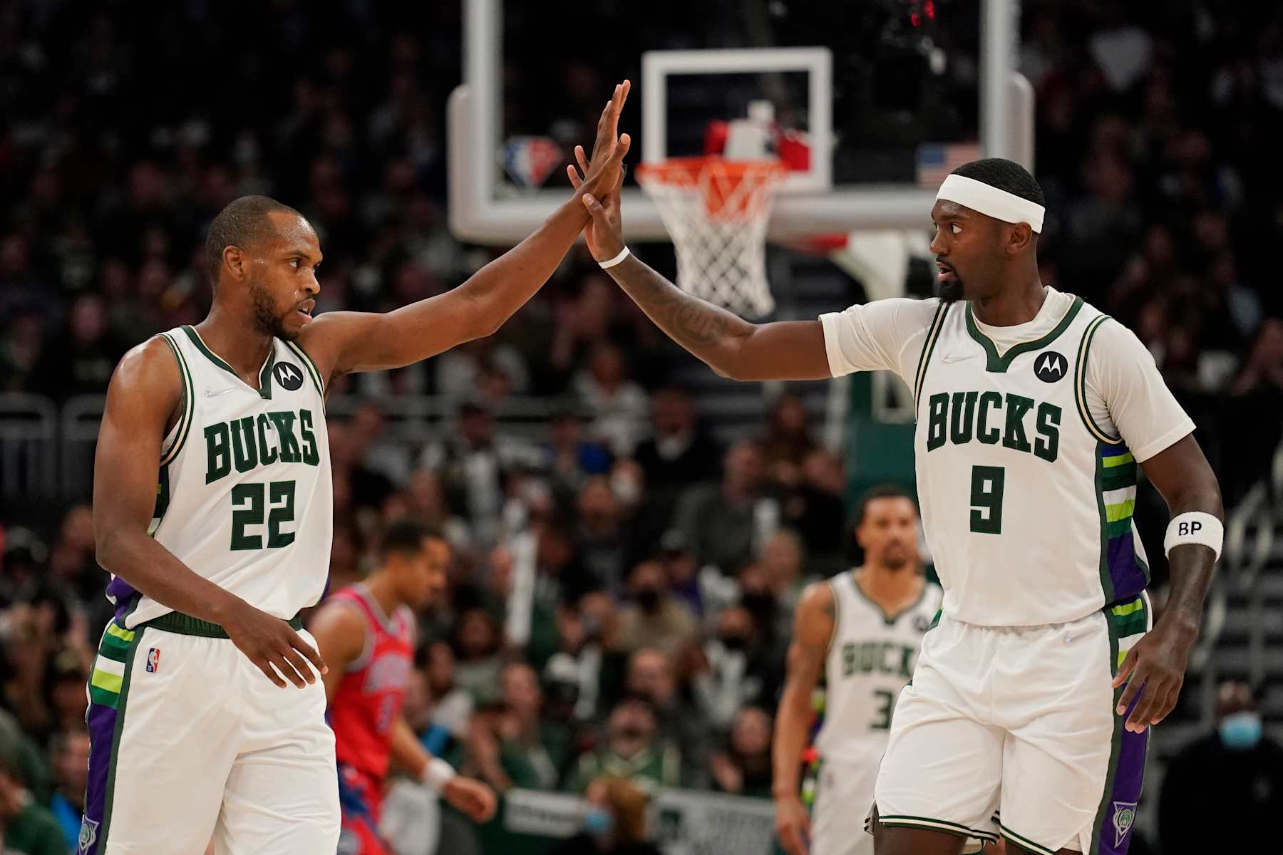 MILWAUKEE, WISCONSIN - NOVEMBER 24: Khris Middleton #22 and Bobby Portis #9 of the Milwaukee Bucks celebrate in the second half against the Detroit Pistons at Fiserv Forum on November 24, 2021 in Milwaukee, Wisconsin. NOTE TO USER: User expressly acknowledges and agrees that, by downloading and or using this photograph, user is consenting to the terms and conditions of the Getty Images License Agreement. (Photo by Patrick McDermott/Getty Images)