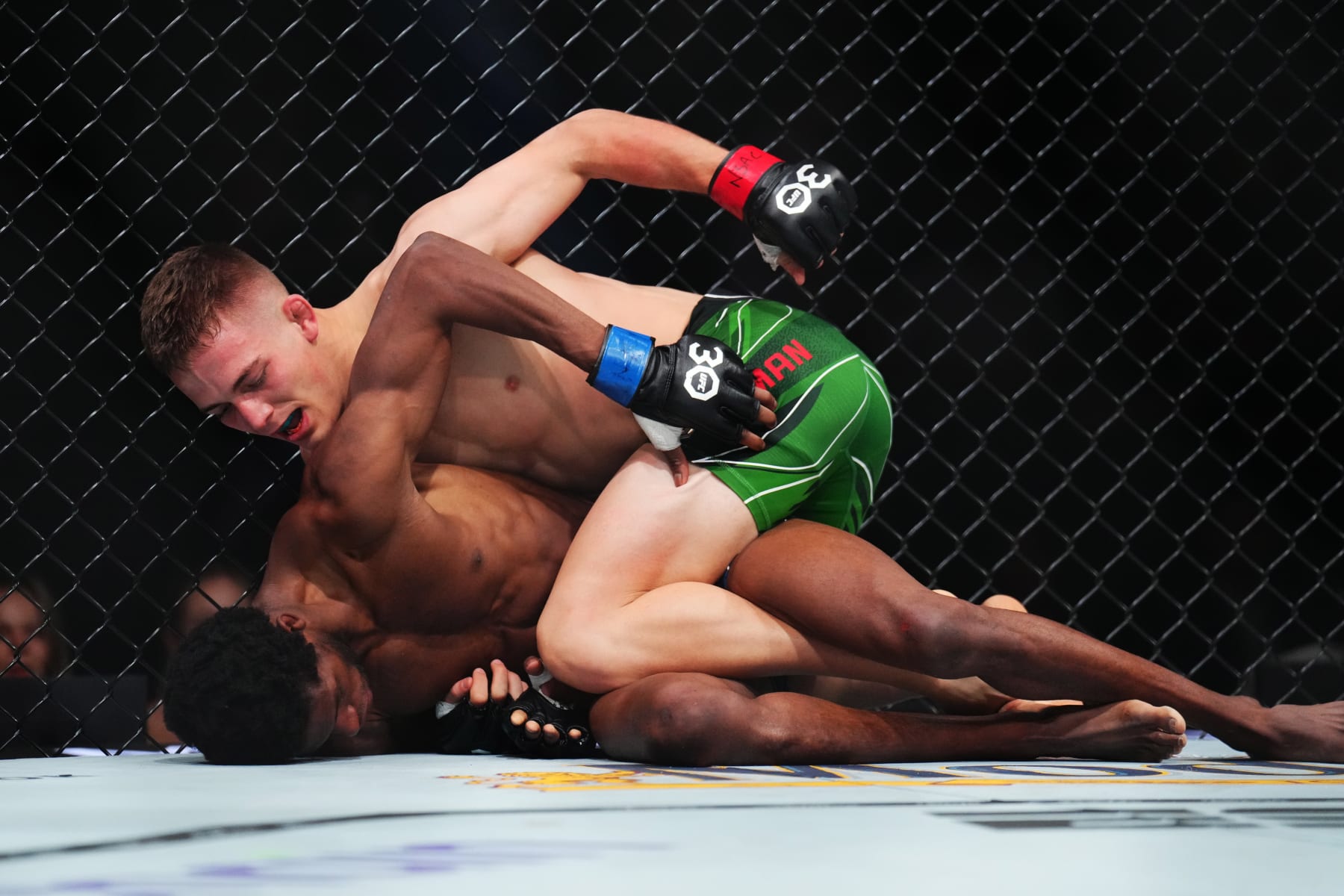 LAS VEGAS, NEVADA - JULY 08: Cameron Saaiman of South Africa punches Terrence Mitchell in a bantamweight fight during the UFC 290 event at T-Mobile Arena on July 08, 2023 in Las Vegas, Nevada. (Photo by Chris Unger/Zuffa LLC via Getty Images) LAS VEGAS, NEVADA - JULY 08: Cameron Saaiman of South Africa punches Terrence Mitchell in a bantamweight fight during the UFC 290 event at T-Mobile Arena on July 08, 2023 in Las Vegas, Nevada. (Photo by Chris Unger/Zuffa LLC via Getty Images)