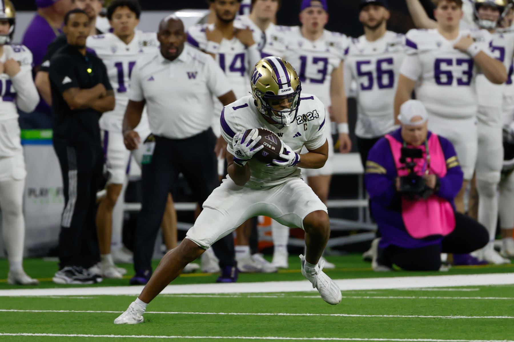 HOUSTON, TX - JANUARY 08: Washington Huskies wide receiver Rome Odunze (1) stops quick after catching a long pass during the CFP National Championship game Michigan Wolverines and Washington Huskies on January 8, 2024, at NRG Stadium in Houston, Texas. (Photo by David Buono/Icon Sportswire via Getty Images)
