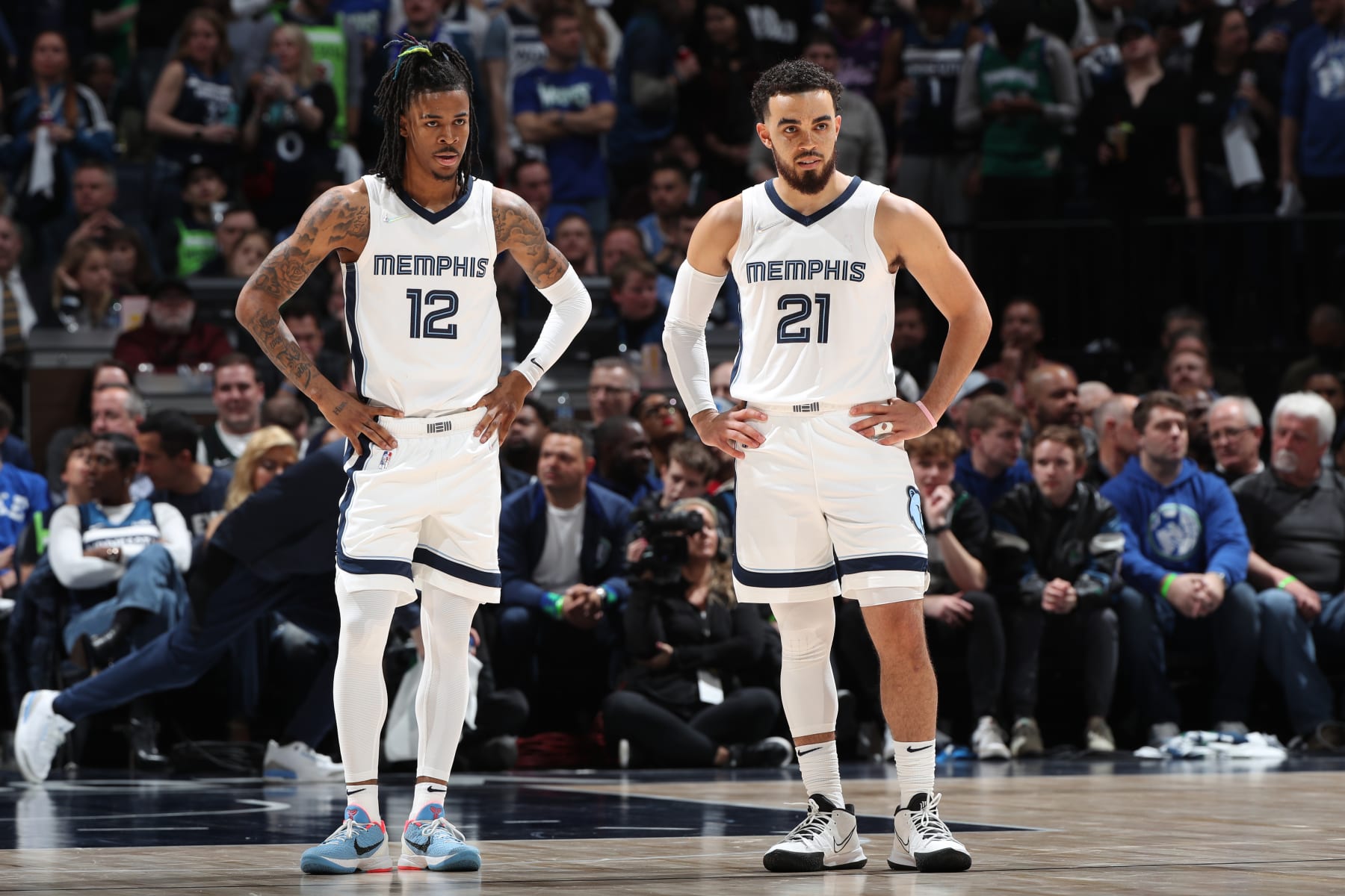 MINNEAPOLIS, MN -  APRIL 21: Ja Morant #12 of the Memphis Grizzlies and Tyus Jones #21 of the Memphis Grizzlies look  on during Round 1 Game 3 of the 2022 NBA Playoffs on April 21, 2022 at Target Center in Minneapolis, Minnesota. NOTE TO USER: User expressly acknowledges and agrees that, by downloading and or using this Photograph, user is consenting to the terms and conditions of the Getty Images License Agreement. Mandatory Copyright Notice: Copyright 2022 NBAE (Photo by Joe Murphy/NBAE via Getty Images)