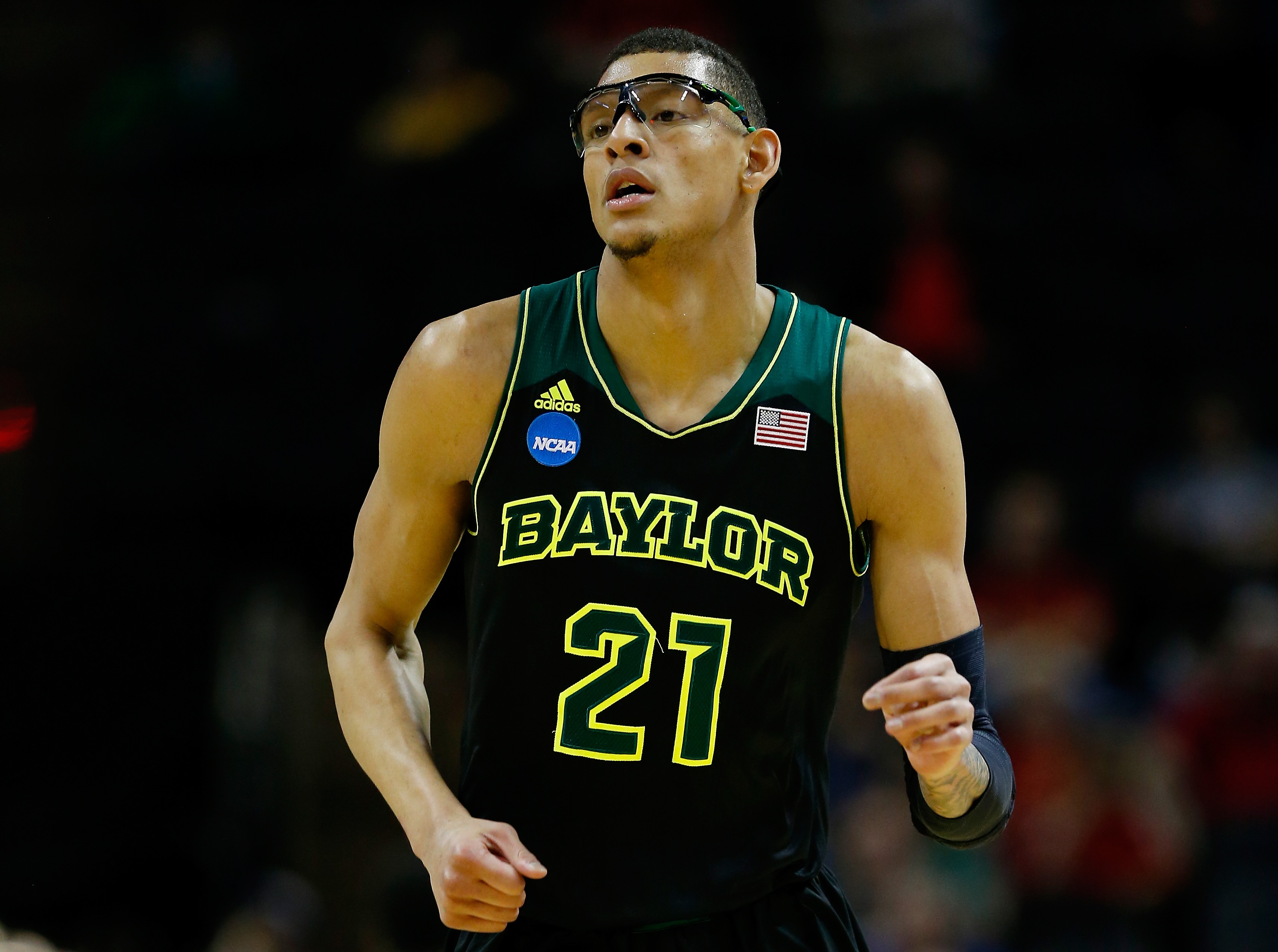 SAN ANTONIO, TX - MARCH 23: Isaiah Austin #21 of the Baylor Bears runs up the floor against the Creighton Bluejays during the third round of the 2014 NCAA Men's Basketball Tournament at the AT&T Center on March 23, 2014 in San Antonio, Texas.  (Photo by Tom Pennington/Getty Images)