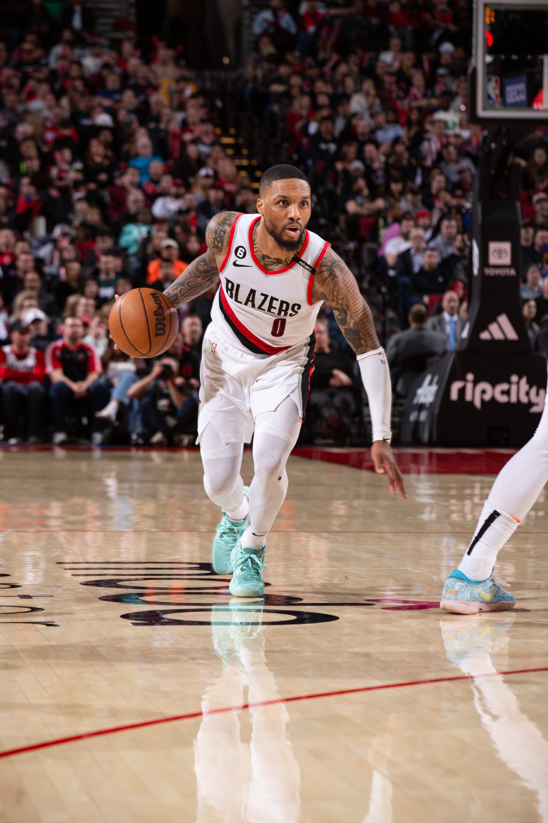PORTLAND, OR - MARCH 14:  Damian Lillard #0 of the Portland Trail Blazers goes to the basket during the game on March 14, 2023 at the Moda Center Arena in Portland, Oregon. NOTE TO USER: User expressly acknowledges and agrees that, by downloading and or using this photograph, user is consenting to the terms and conditions of the Getty Images License Agreement. Mandatory Copyright Notice: Copyright 2023 NBAE (Photo by Cameron Browne/NBAE via Getty Images)