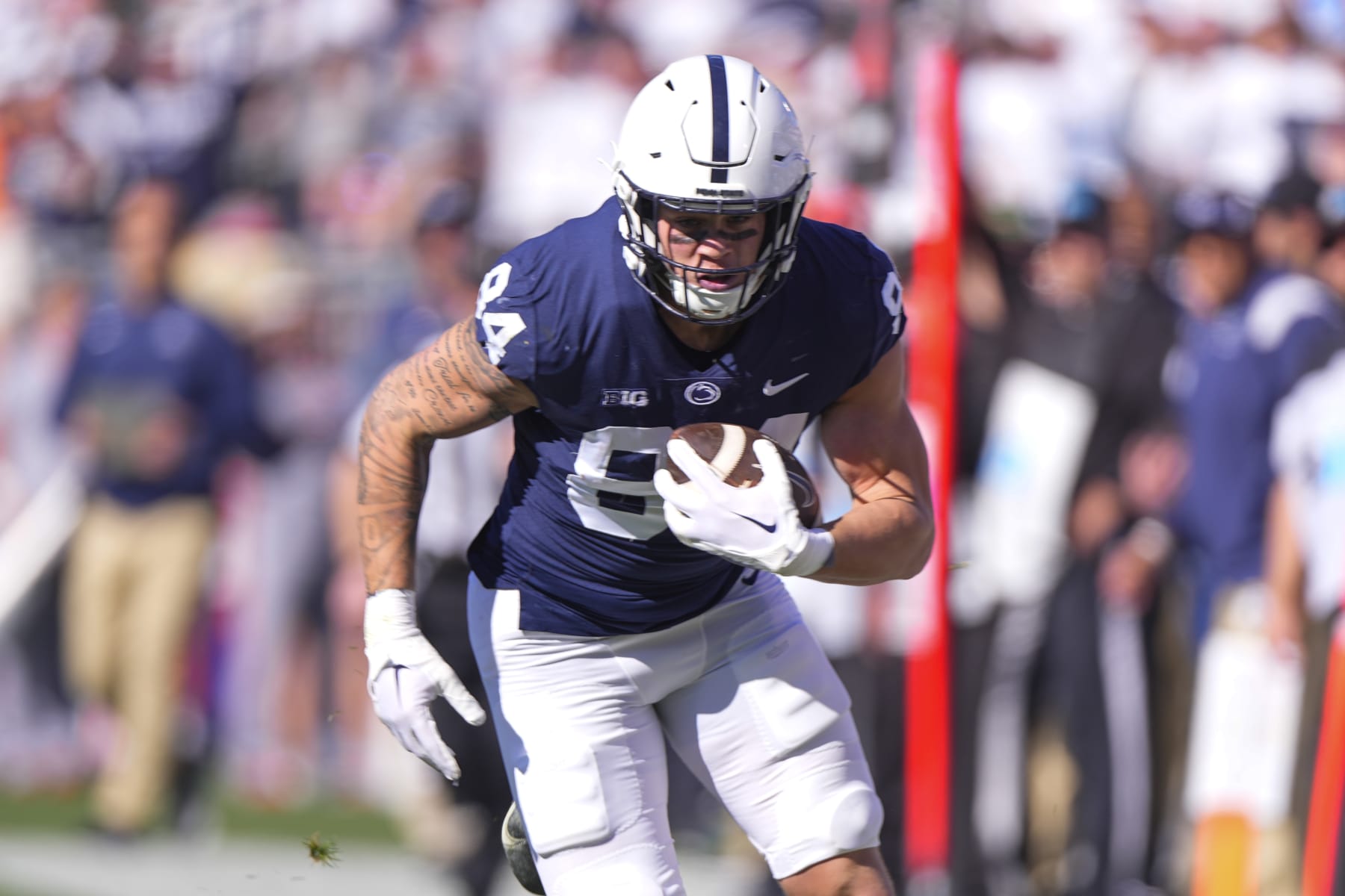 UNIVERSITY PARK, PA - OCTOBER 29: Penn State Nittany Lions Tight End Theo Johnson (84) runs with the ball after making a catch during the first half of the college football game between the Ohio State Buckeyes and the Penn State Nittany Lions on October 29, 2022, at Beaver Stadium in University Park, PA. (Photo by Gregory Fisher/Icon Sportswire via Getty Images)