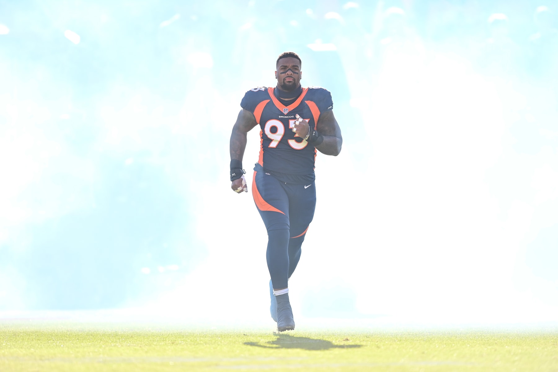 DENVER, CO - DECEMBER 11: Denver Broncos defensive end Dre'Mont Jones (93) runs onto the field during starting lineup introductions before a game between the Kansas City Chiefs and the Denver Broncos at Empower Field at Mile High on December 11, 2022 in Denver, Colorado. (Photo by Dustin Bradford/Icon Sportswire via Getty Images)