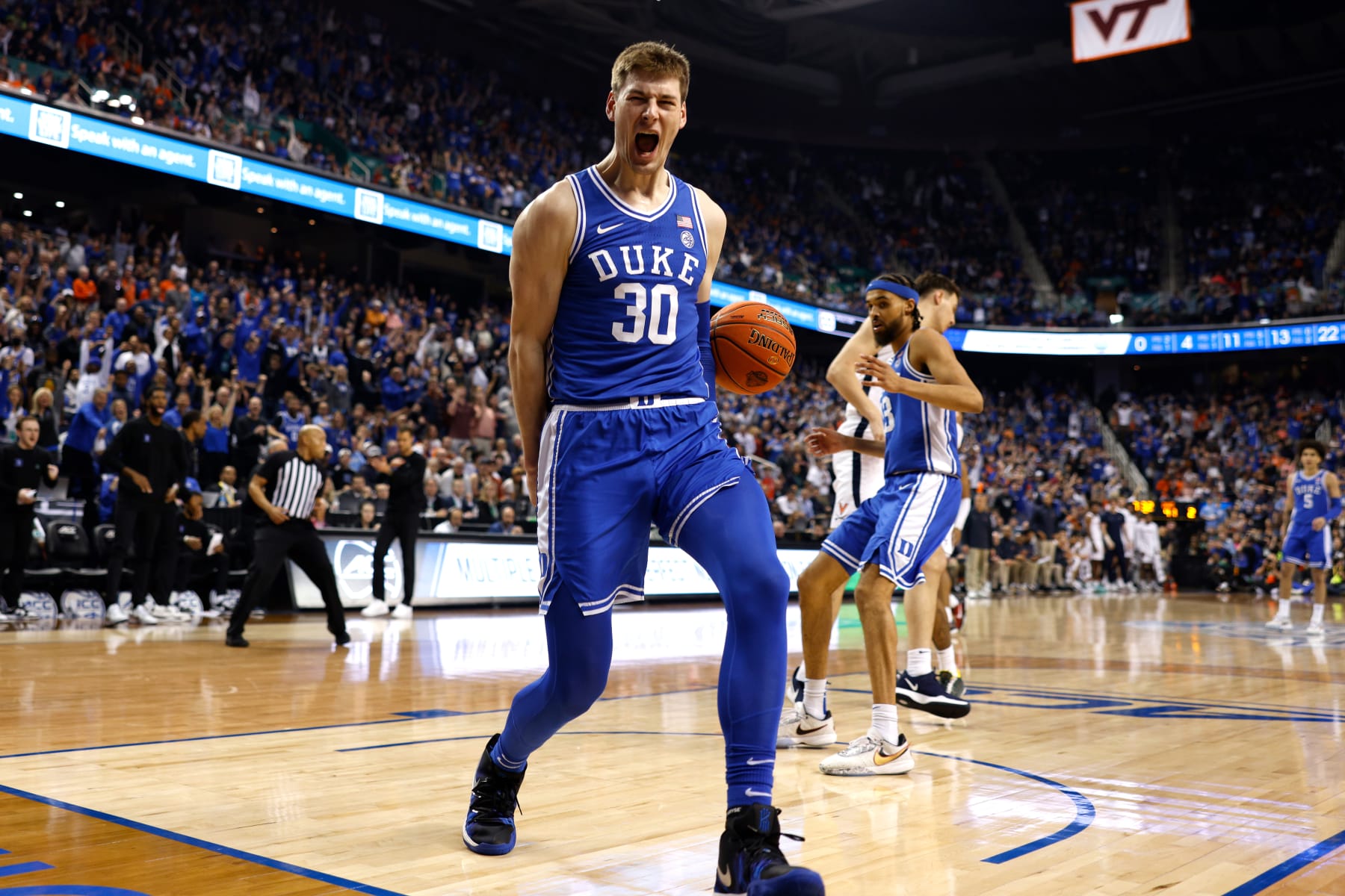 GREENSBORO, NC - MARCH 11: Kyle Filipowski #30 of the Duke Blue Devils reacts following a dunk against the Virginia Cavaliers during the second half of the ACC Basketball Tournament Championship game at Greensboro Coliseum on March 11, 2023 in Greensboro, North Carolina. (Photo by Lance King/Getty Images)