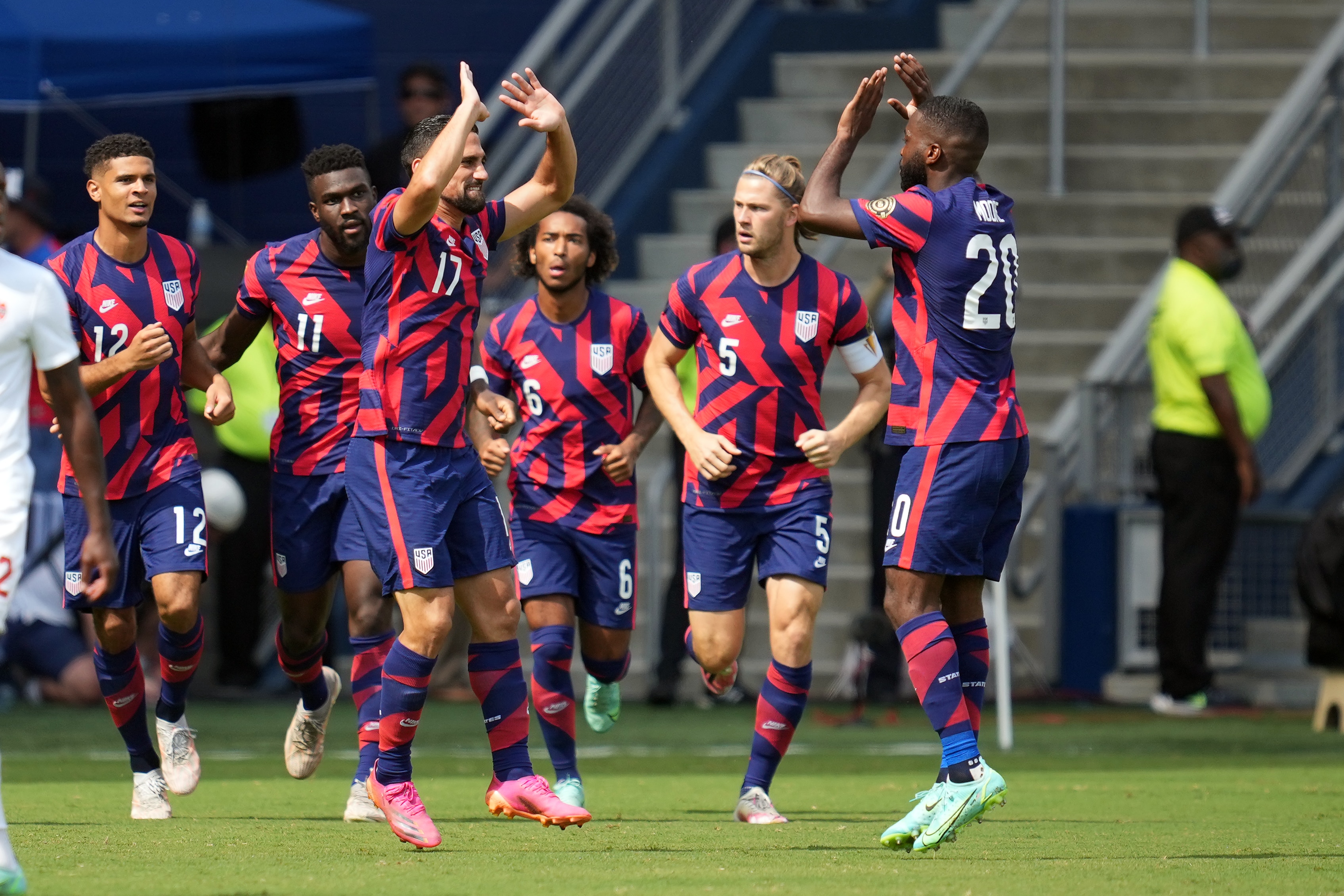 KANSAS CITY, KS - JULY 18: United States defender Shaq Moore (20) celebrates with fans and teammates after scoring a goal in action during the CONCACAF Gold Cup Group B match between the United States and Canada on July 18, 2021 at Children's Mercy Park in Kansas City, KS. (Photo by Robin Alam/Icon Sportswire via Getty Images)